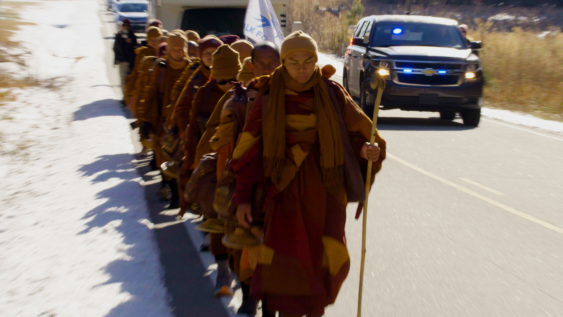 Five miles from the Virginia border, the monks continue north after walking through a snowstorm on their final stretch out of North Carolina.