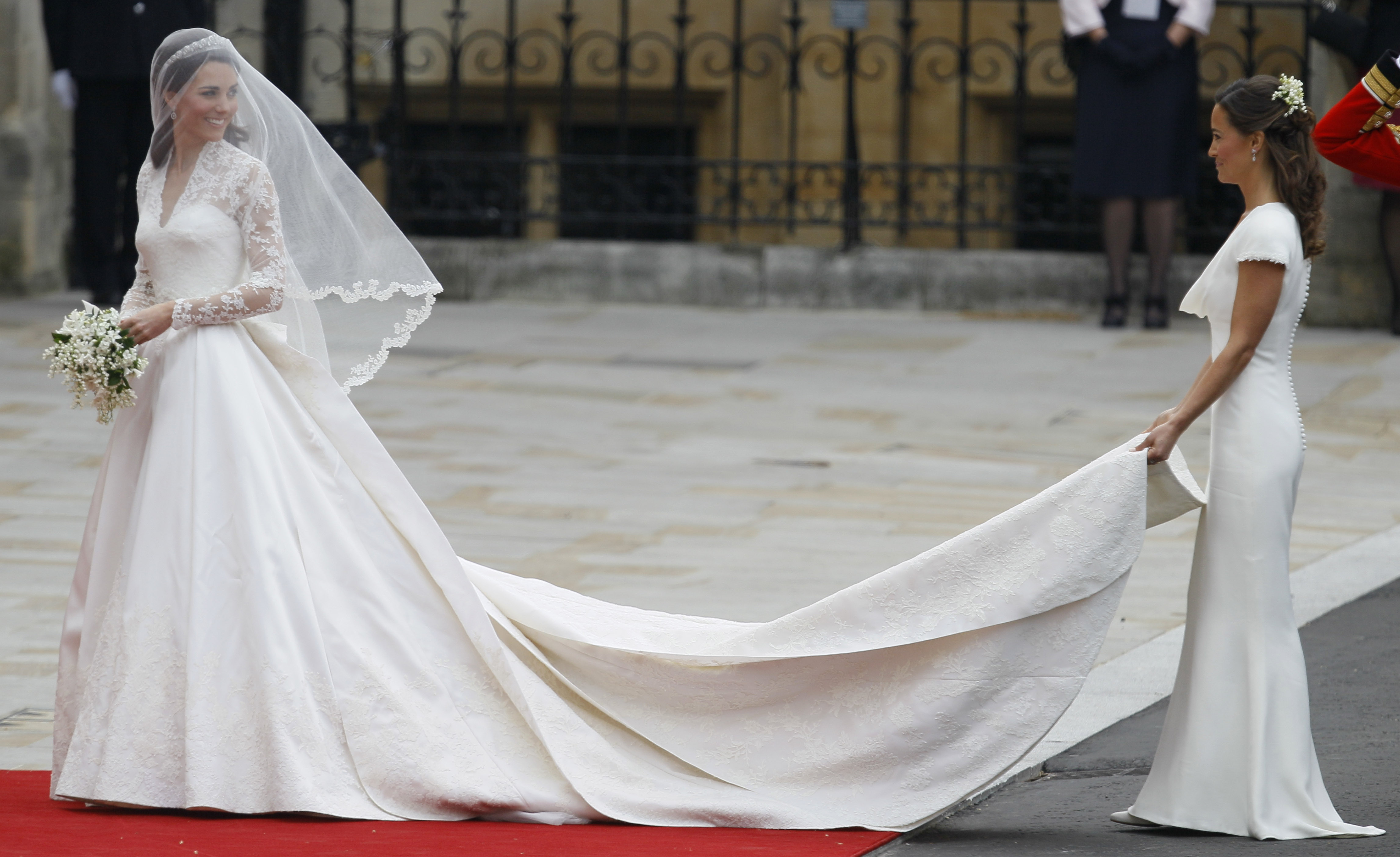 Kate Middleton, left, and accompanied by maid of honour Pippa Middleton as they arrive at Westminster Abbey at the Royal Wedding in London Friday, April 29, 2011.
