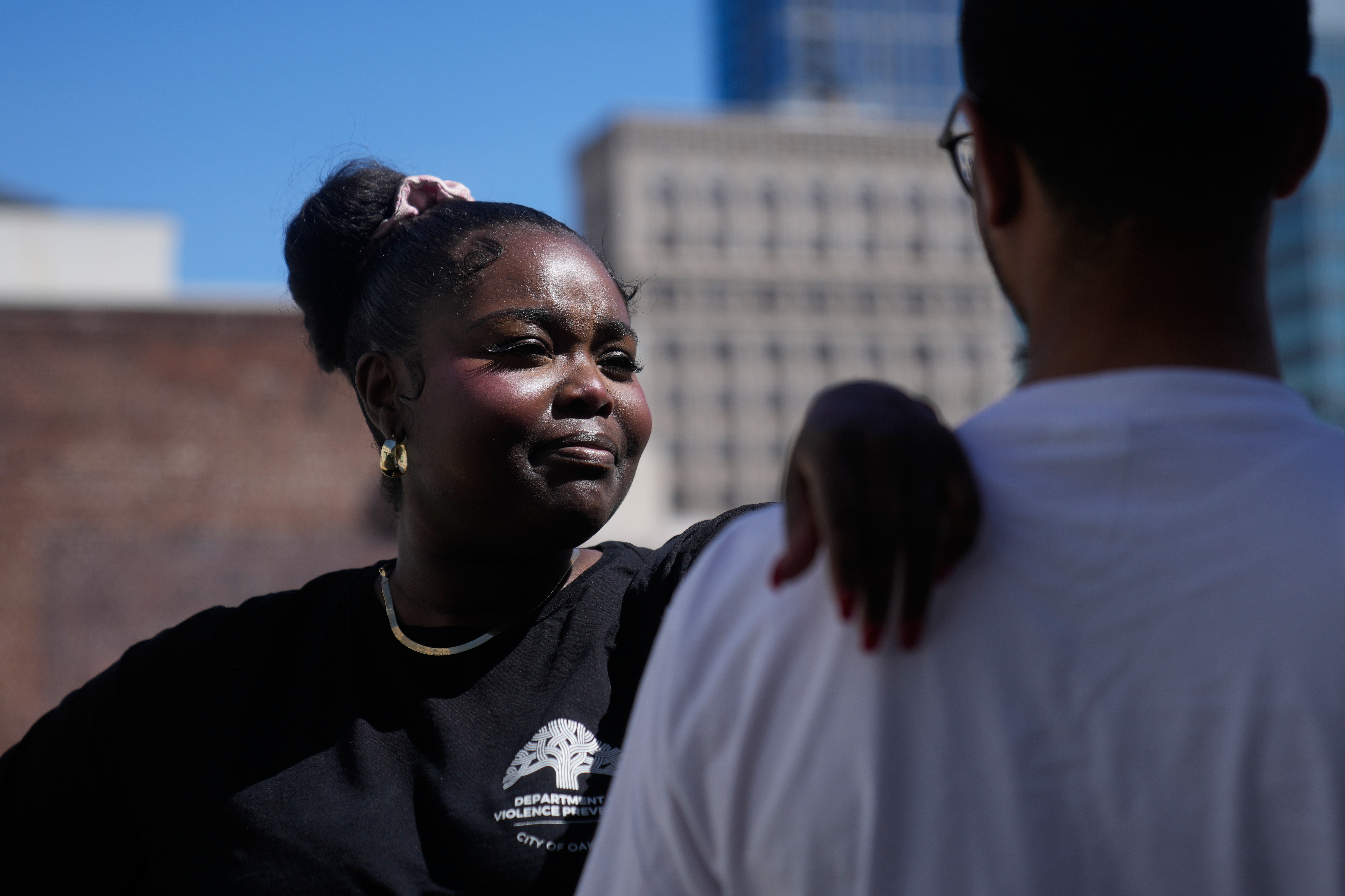 Oakland Ceasefire-Lifeline life coach LaSasha Long, left, laughs with Bernard C. during an interview Thursday, April 23, 2026, in Oakland, Calif.
