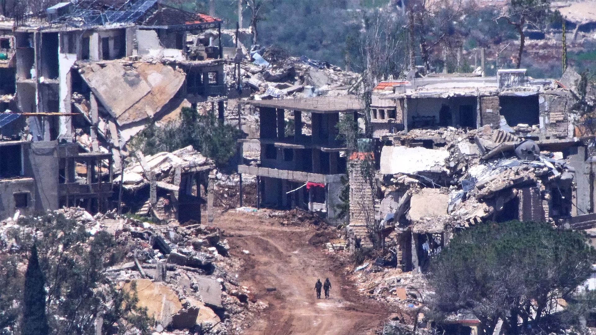 Two Israeli soldiers operate in southern Lebanon, as seen from northern Israel, Wednesday, April 29, 2026.