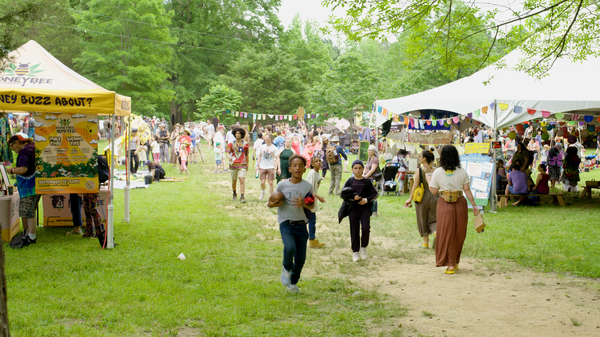 Festivalgoers walk through the grounds at Shakori Hills GrassRoots Festival of Music and Dance near Pittsboro.