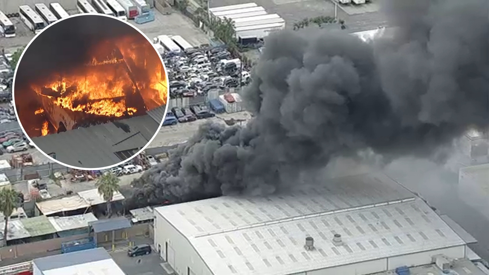 Large fire engulfs multiple vehicles at Pacoima auto salvage yard, sending black smoke billowing into the air