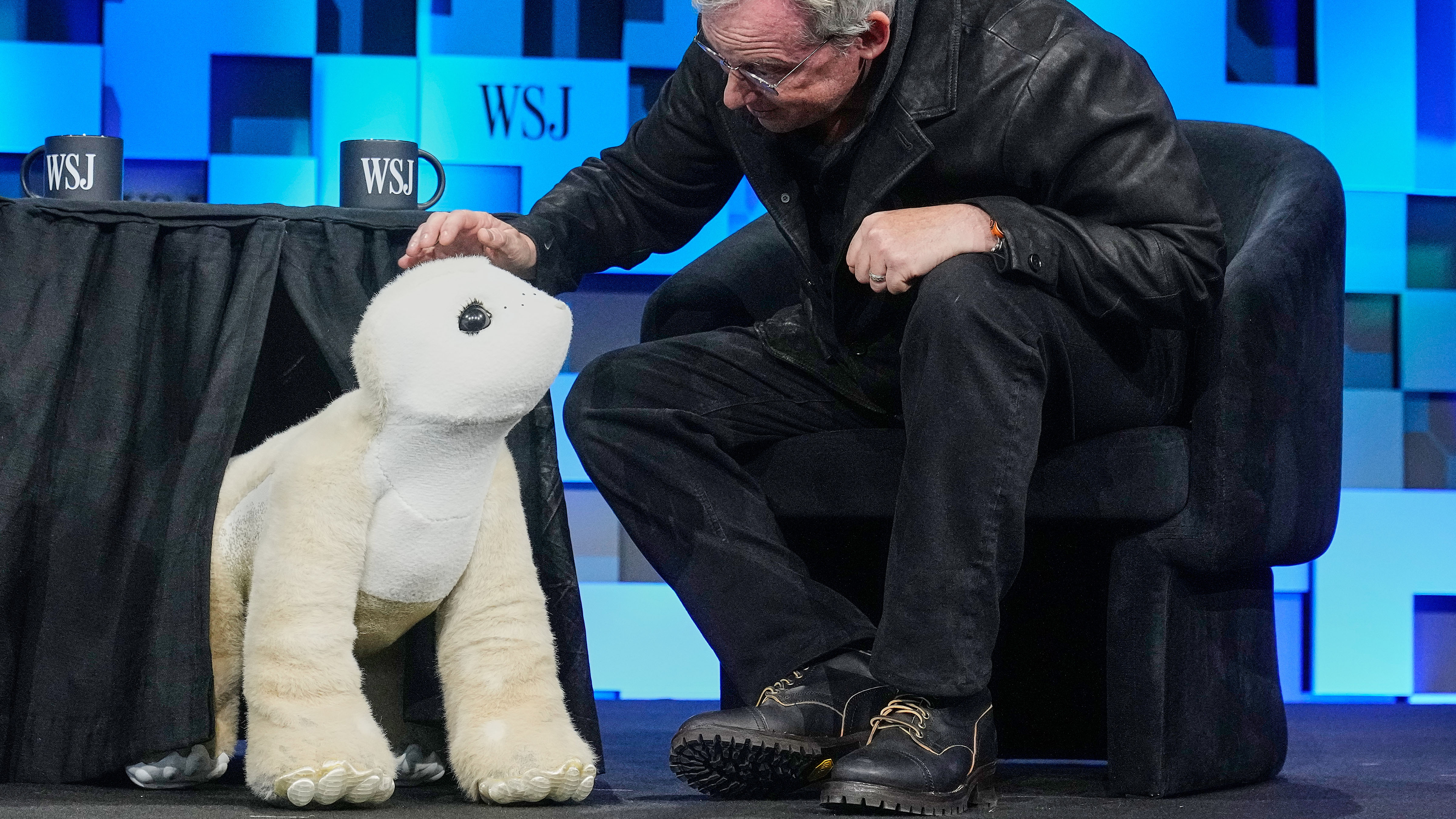 Colin Angle, longtime CEO of Roomba, unveils a four-legged prototype of artificial pet Daphne, called a Familiar, at The WSJ Future of Everything, in New York, Monday, May 4, 2026. 