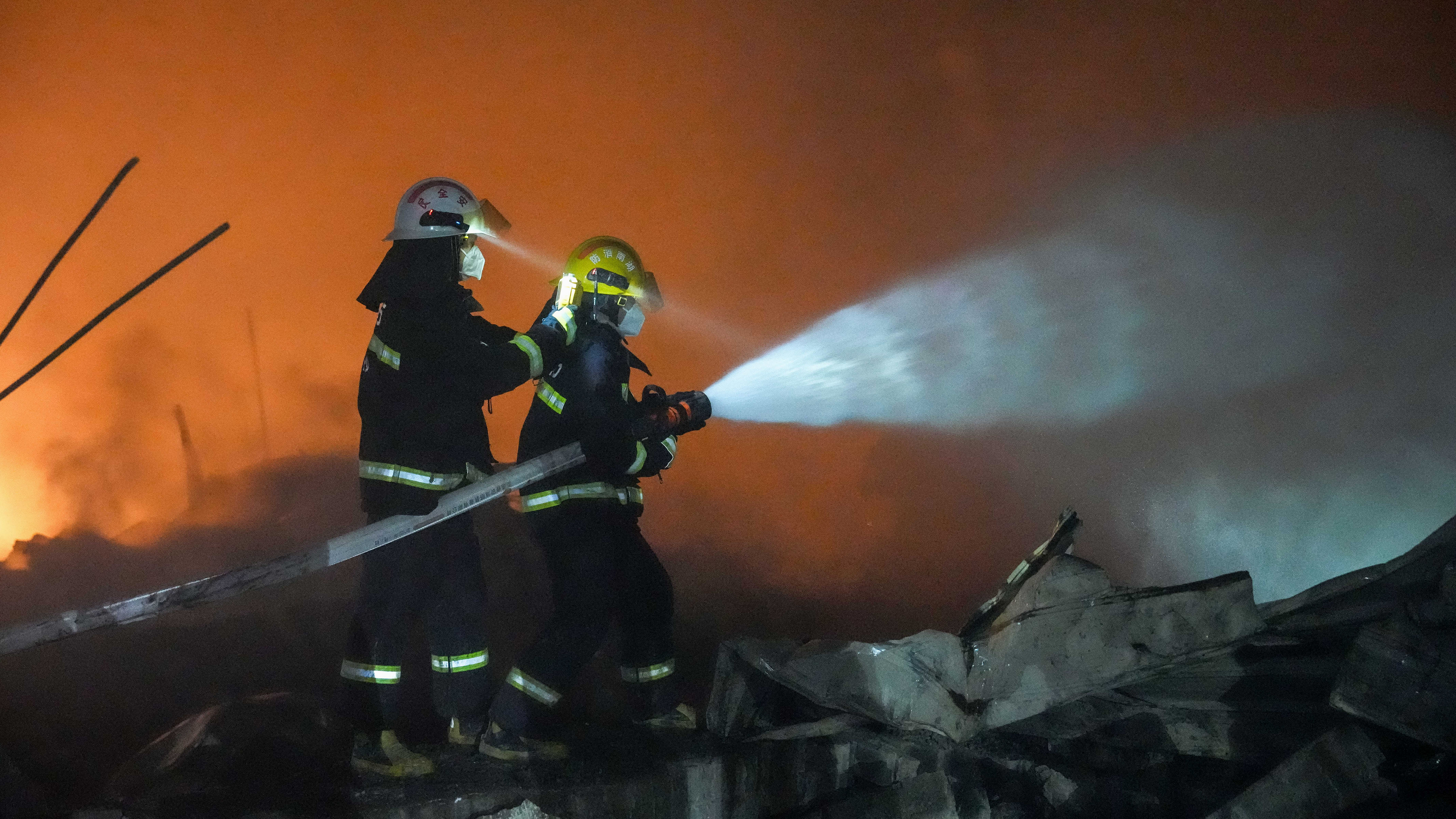 In this photo released by Xinhua News Agency, firefighters work to out the fire after an explosion at a fireworks plant in Guandu Town of Liuyang, central China's Hunan Province, in the early hours of May 5, 2026. 