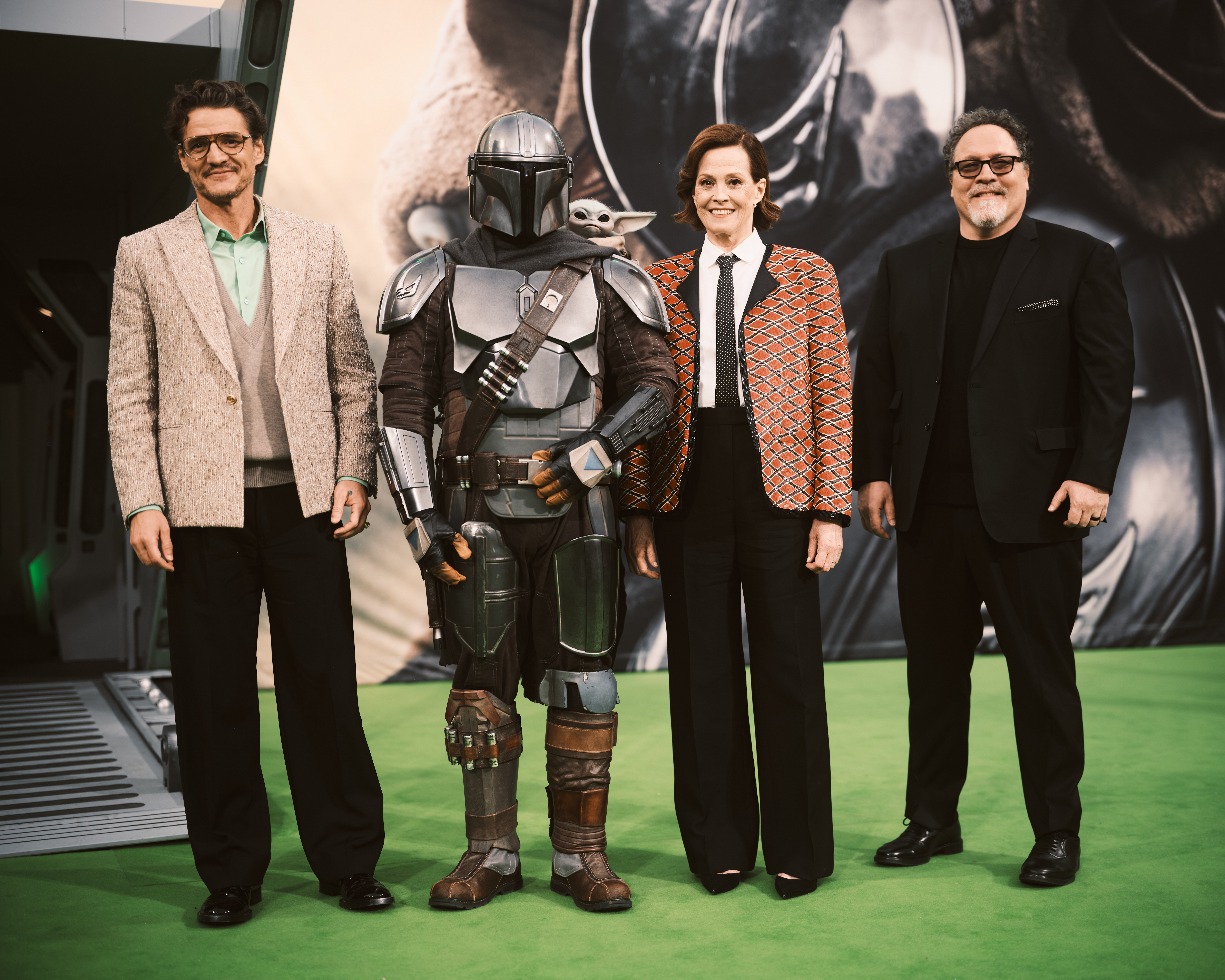 Pedro Pascal, The Mandalorian, Grogu, Sigourney Weaver and Jon Favreau attend the Berlin Fan Celebration of "Star Wars: The Mandalorian and Grogu" at Uber Platz.