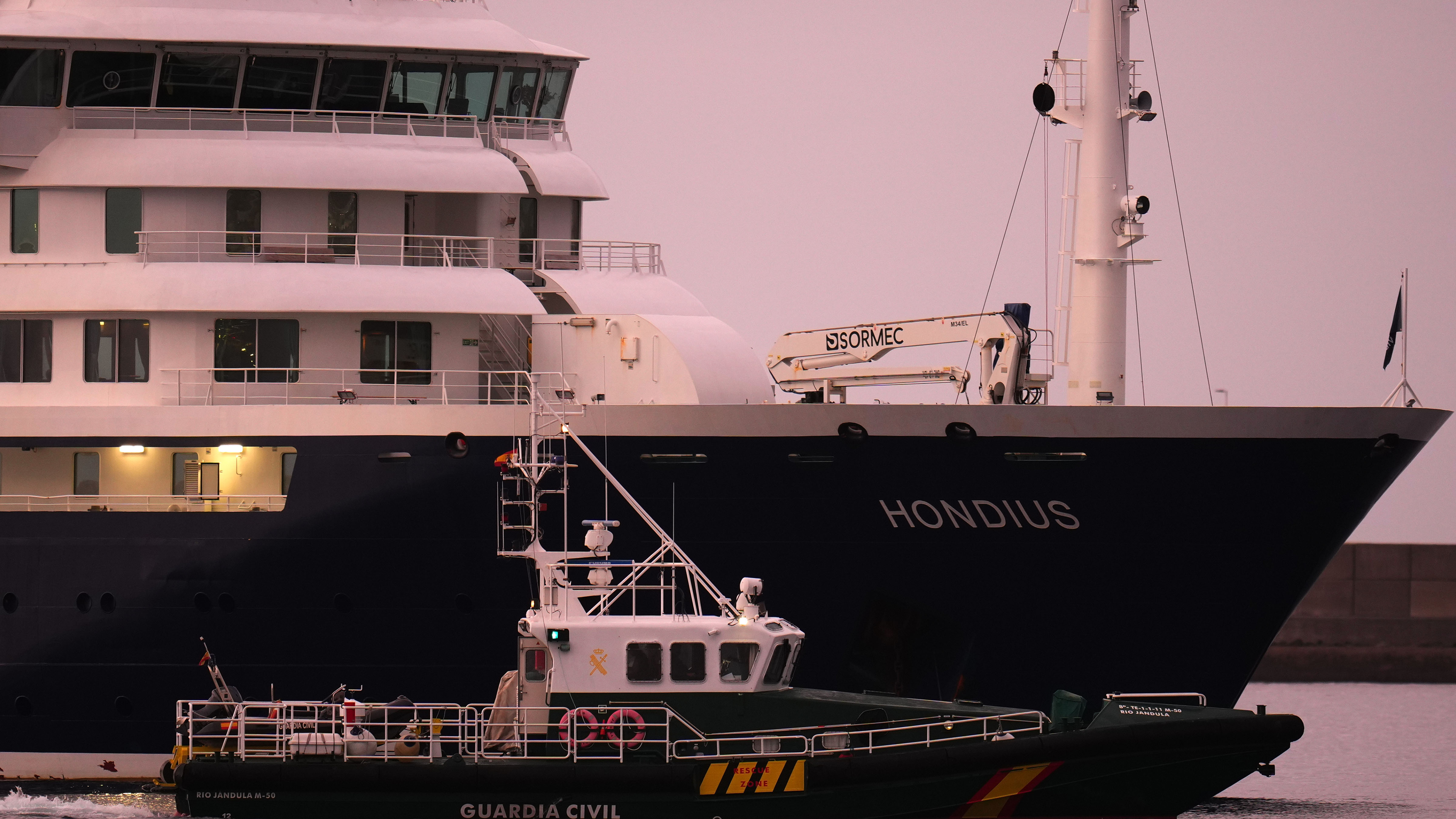 The hantavirus-stricken cruise ship MV Hondius is seen at anchor after arriving at the port of Granadilla in Tenerife, Canary Islands, Spain, Sunday, May 10, 2026.