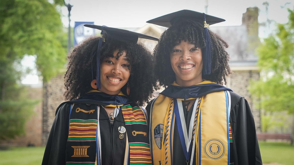 Twin sisters graduate as valedictorian and salutatorian