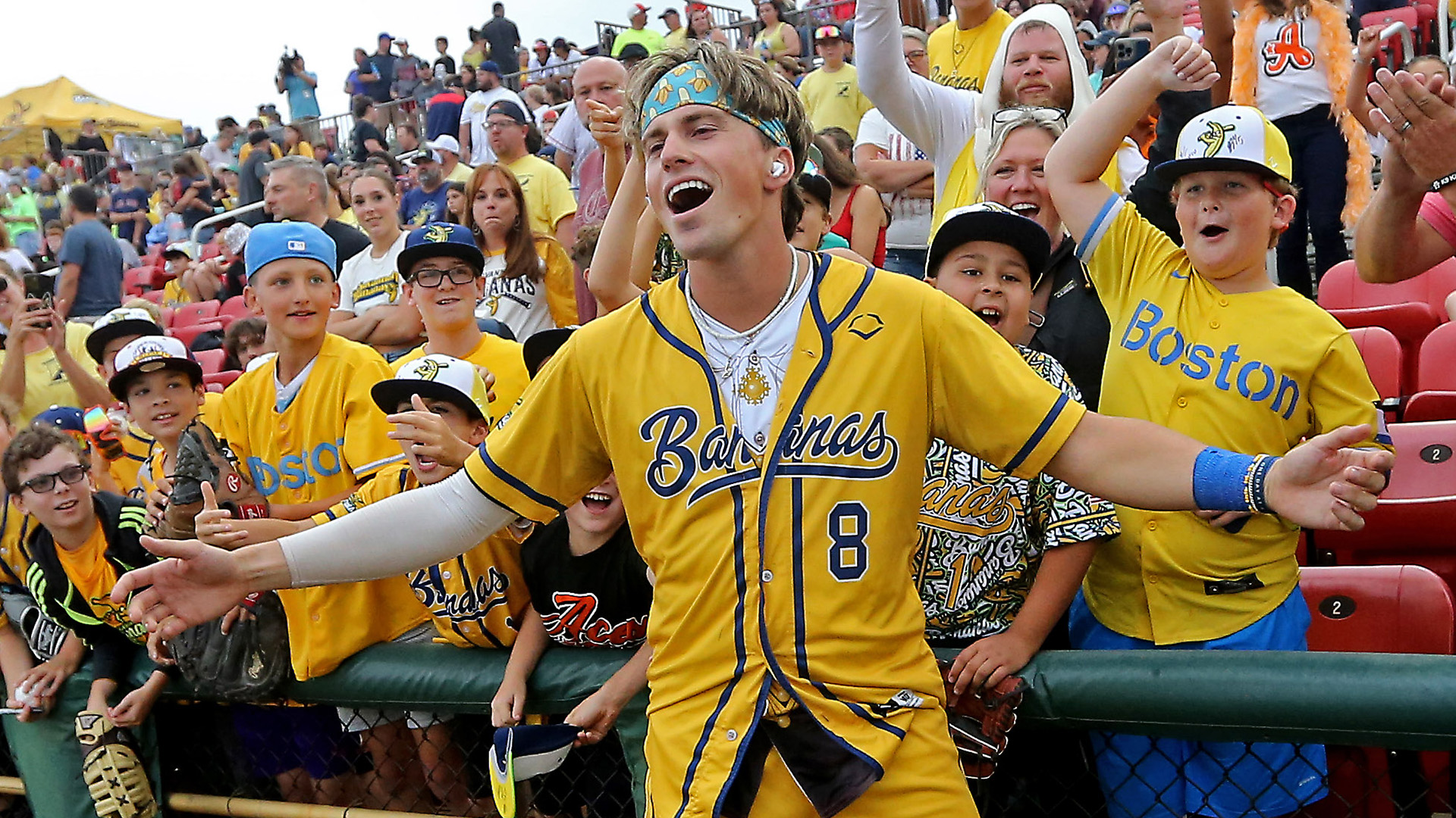 Jackson Olson poses with fans as the Savannah Bananas take on the Party Animals at Campanelli Stadium on Aug. 16, 2023 in Brockton, Mass. 