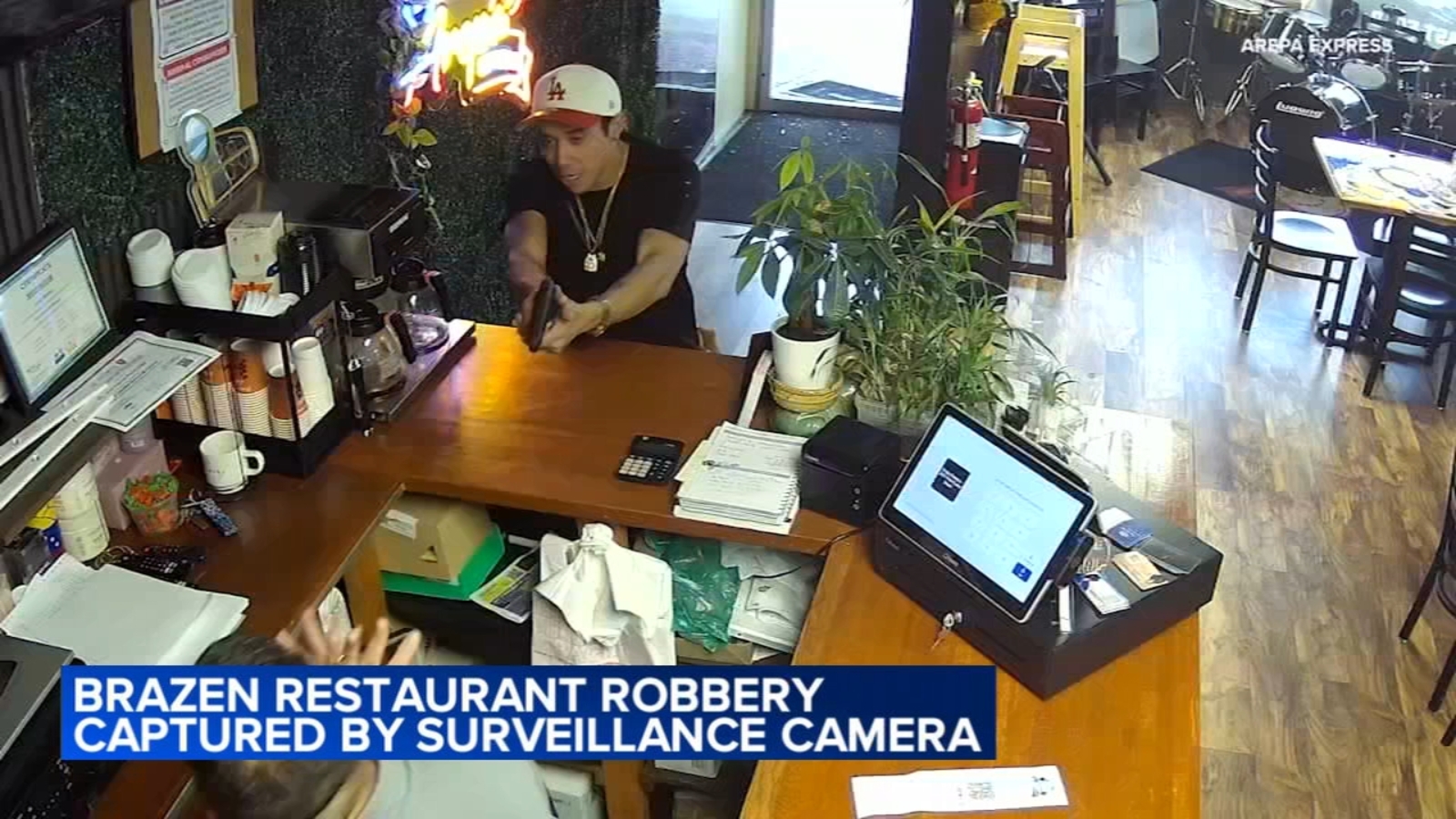 Brazen armed robbery at west suburban restaurant caught on camera