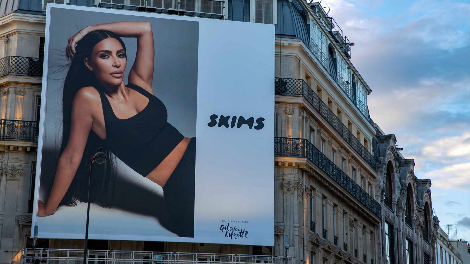 A SKIMS giant poster with Kim Kardashian West is displayed at the 'Galeries Lafayette' department store on October 04, 2021 in Paris, France.
