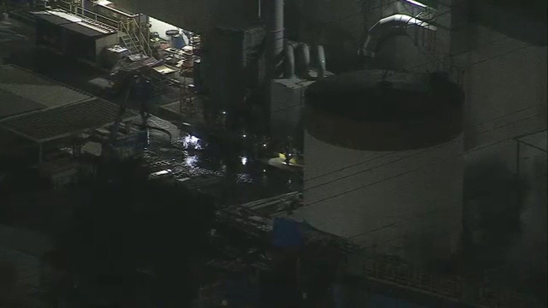 Firefighters seen surrounding tank at center of chemical crisis in
