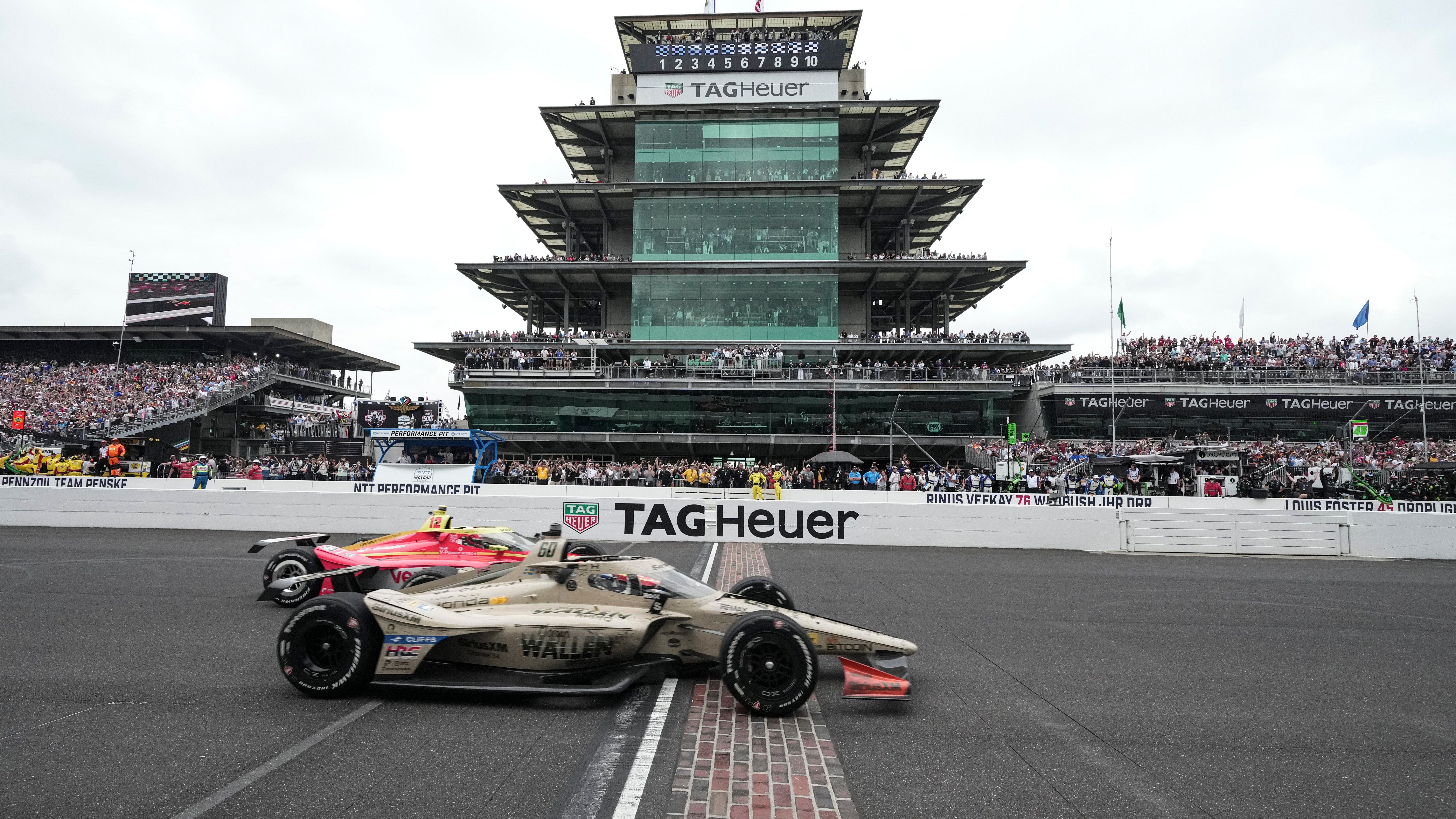 Felix Rosenqvist, foreground, of Sweden, beats David Malukas to the finish line to win the Indianapolis 500 auto race at Indianapolis Motor Speedway in Indianapolis, May 24, 2026