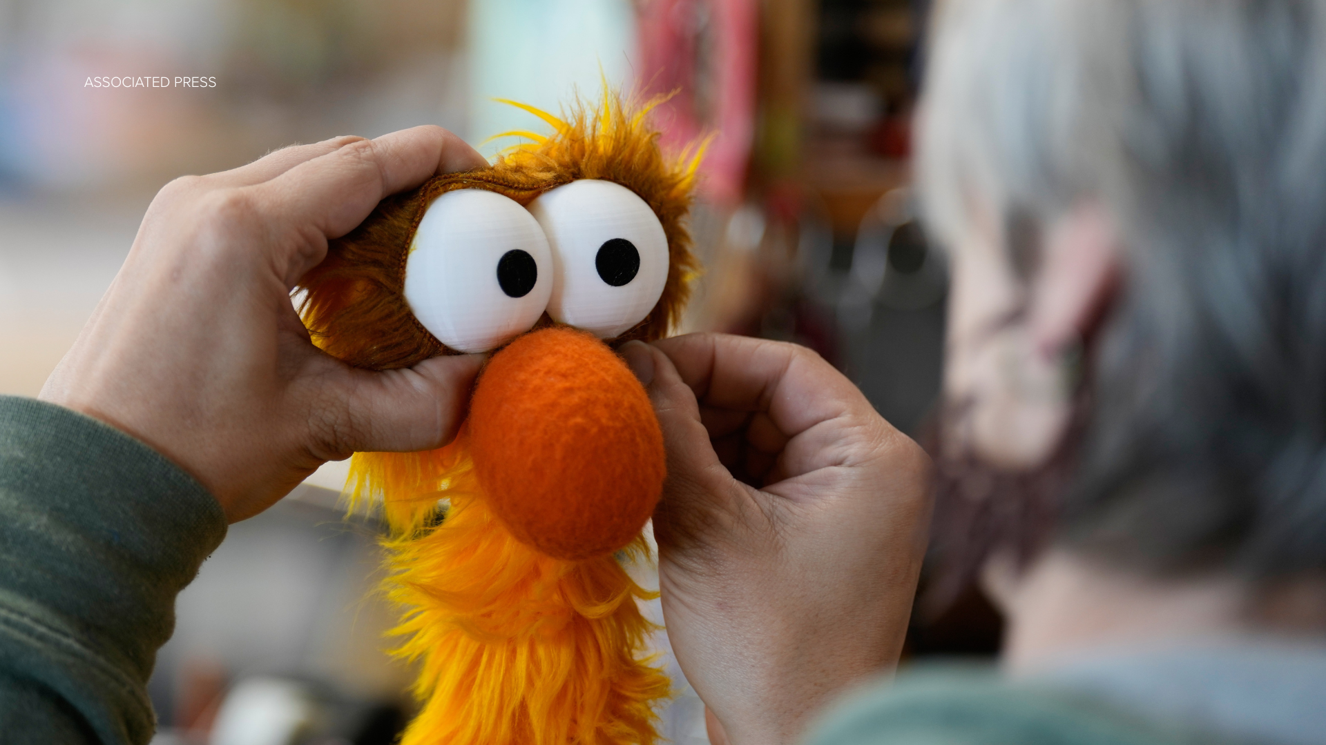 Sierra Schoening, a senior puppet builder, puts some last minute touches on a puppet at Jim Henson's Creature Shop in New York, Wednesday, May 13, 2026. (AP Photo/Seth Wenig)