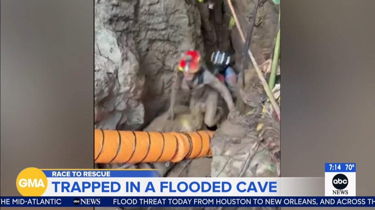 Rescuers evacuate the first of 5 villagers found trapped in a cave in Laos; 2 still missing
