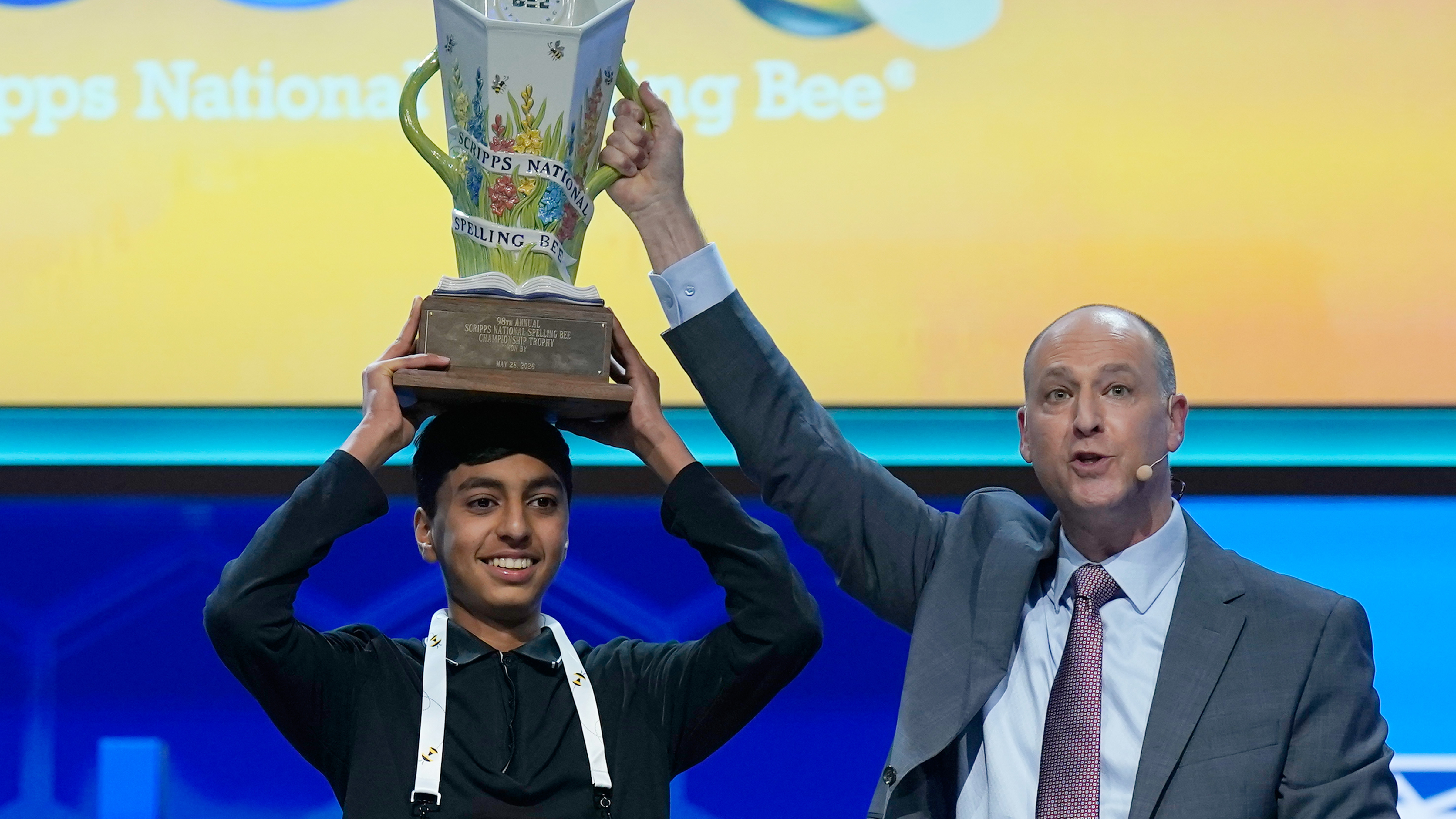 E.W. Scripps Company president and CEO Adam Symson, right, holds the trophy over winner of the 2026 Scripps National Spelling Bee, Shrey Parikh, 14, of Rancho Cucamonga, Calif., at DAR Constitution Hall, Thursday, May 28, 2026, in Washington. 