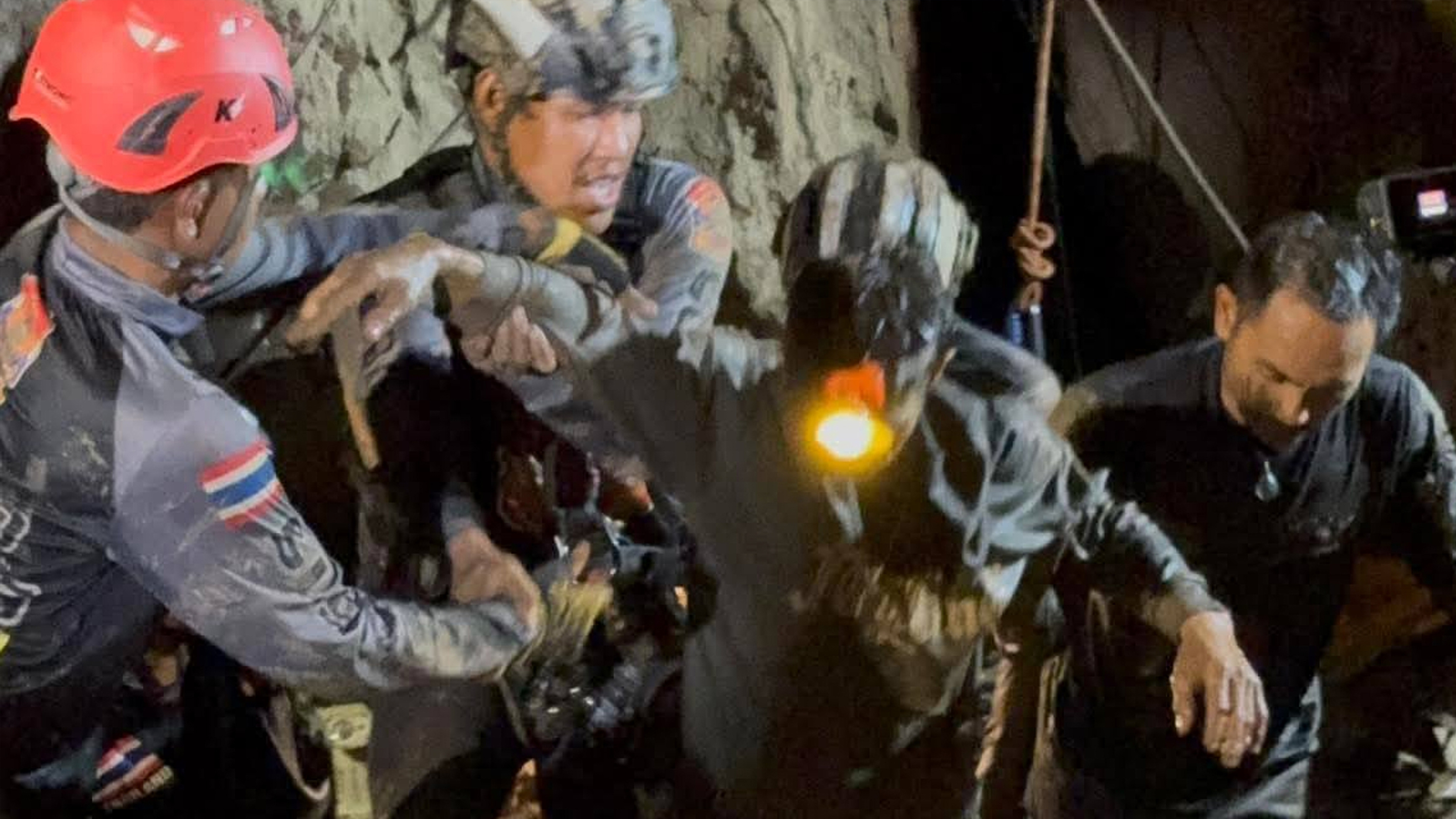 This image released by Metta Tham Rescue Kalasin, Rescuers evacuate the first of five villagers, center, who had been trapped in a cave in Xaisomboun province, Laos, Friday, May 29, 2026.