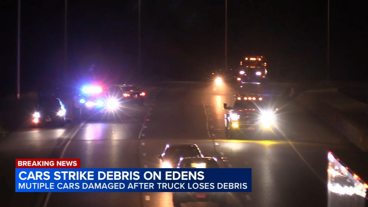 Several cars damaged after debris falls from truck on Edens