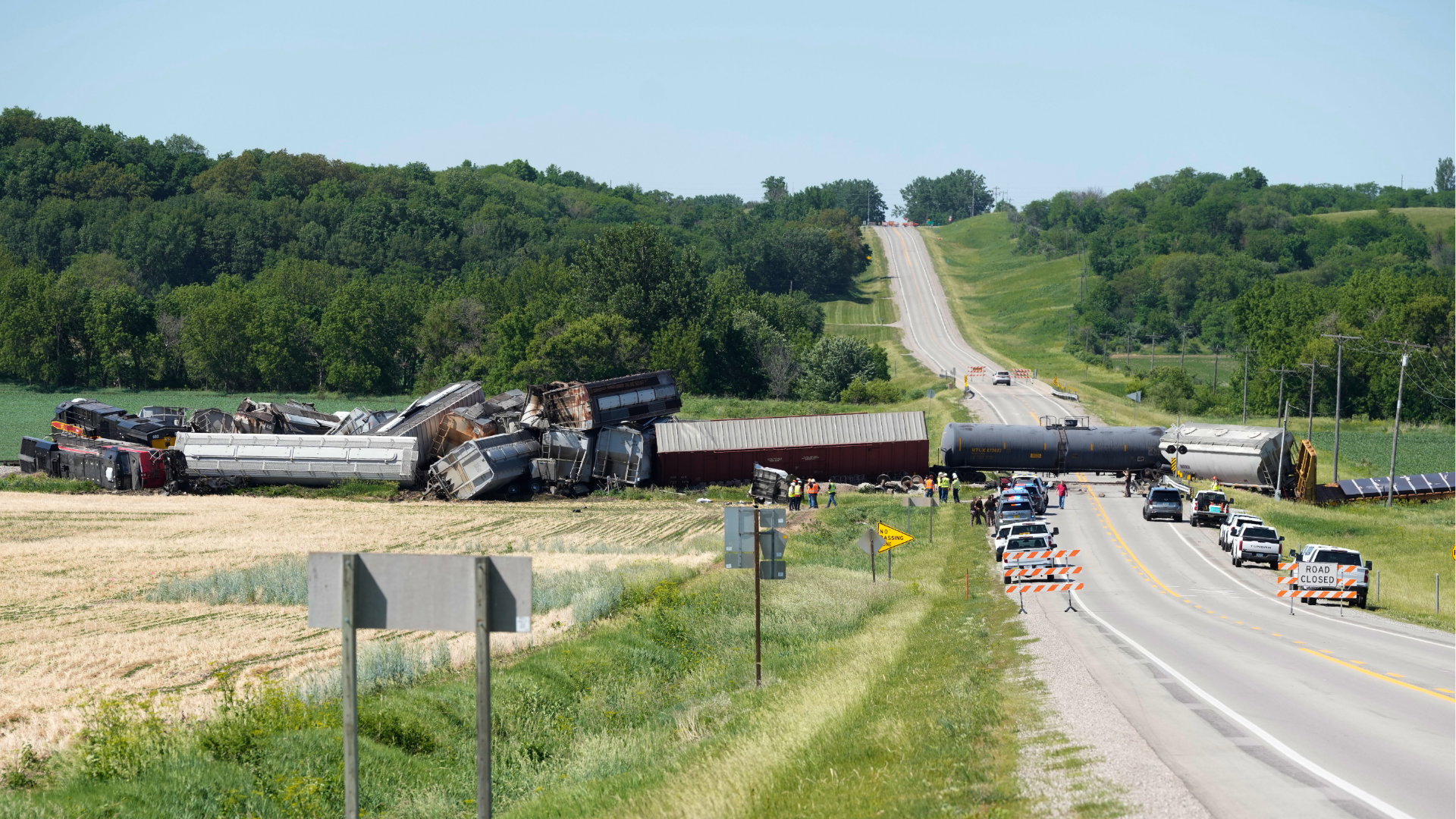Workers and law enforcement respond after a train derailed on Wednesday, June 3, 2026, near Victor, Iowa.