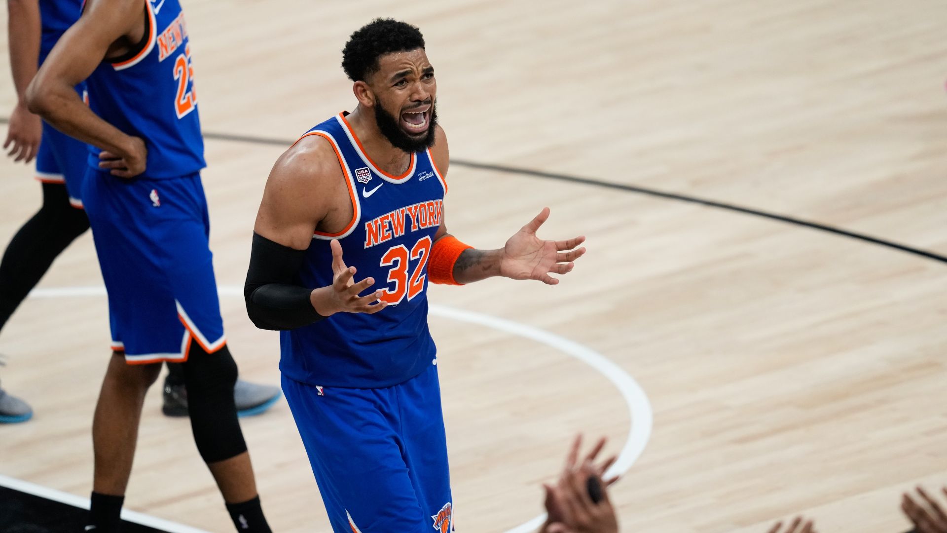 Knicks center Karl-Anthony Towns (32) reacts to a foul call during the second half of Game 2 of the NBA Finals. (AP Photo/David J. Phillip)