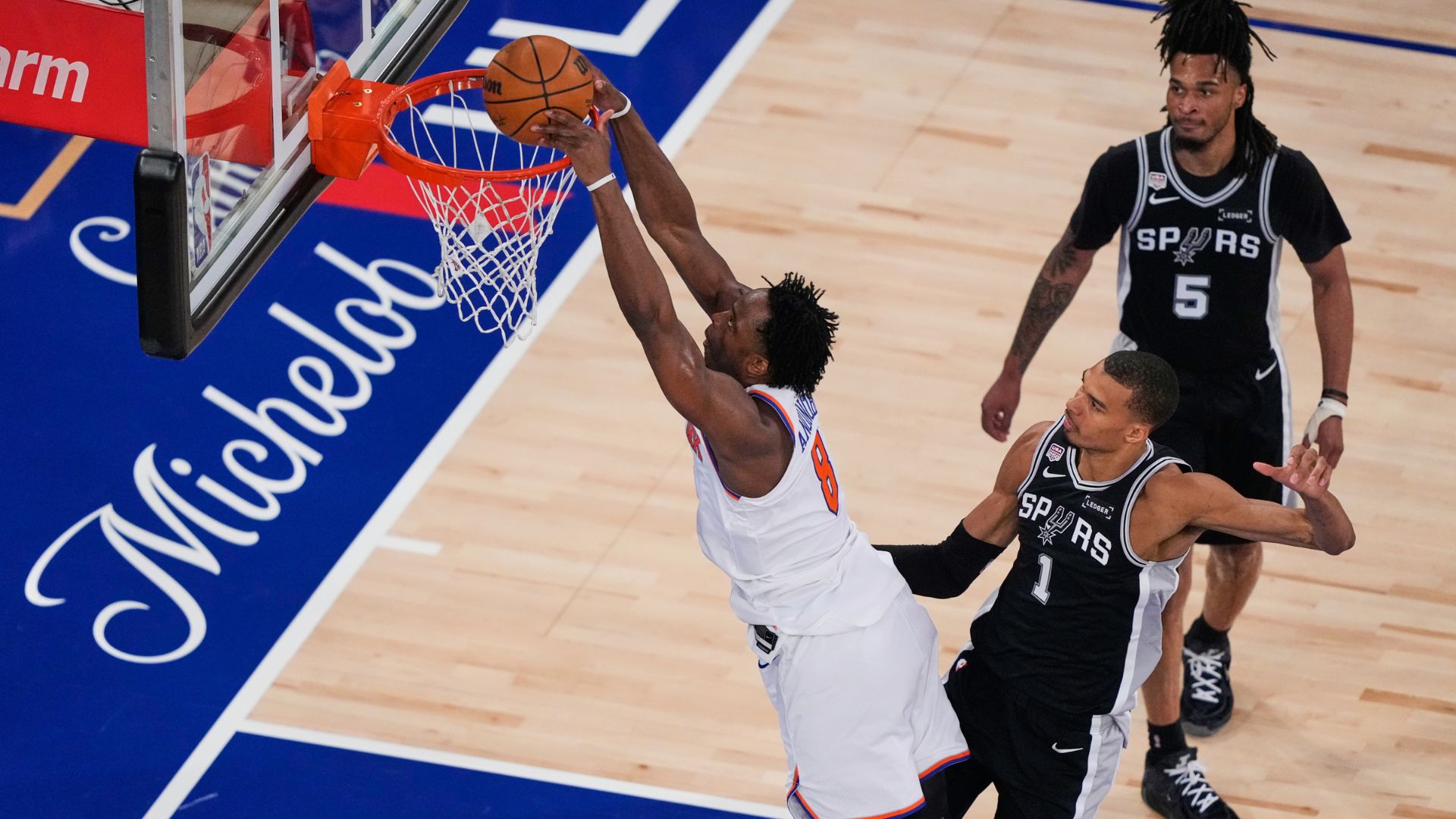 New York Knicks forward Og Anunoby (8) shoots during Game 3 of the NBA Finals basketball series against the San Antonio Spurs. (AP Photo/Yuki Iwamura)