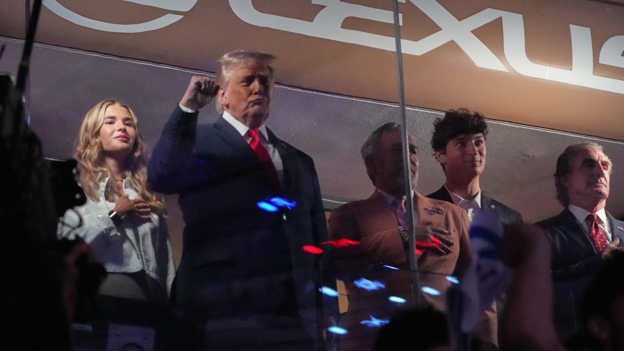President Donald Trump gestures during the National Anthem as he attends a Knicks-Spurs NBA Finals game at Madison Square Garden in New York, Monday, June 8, 2026.