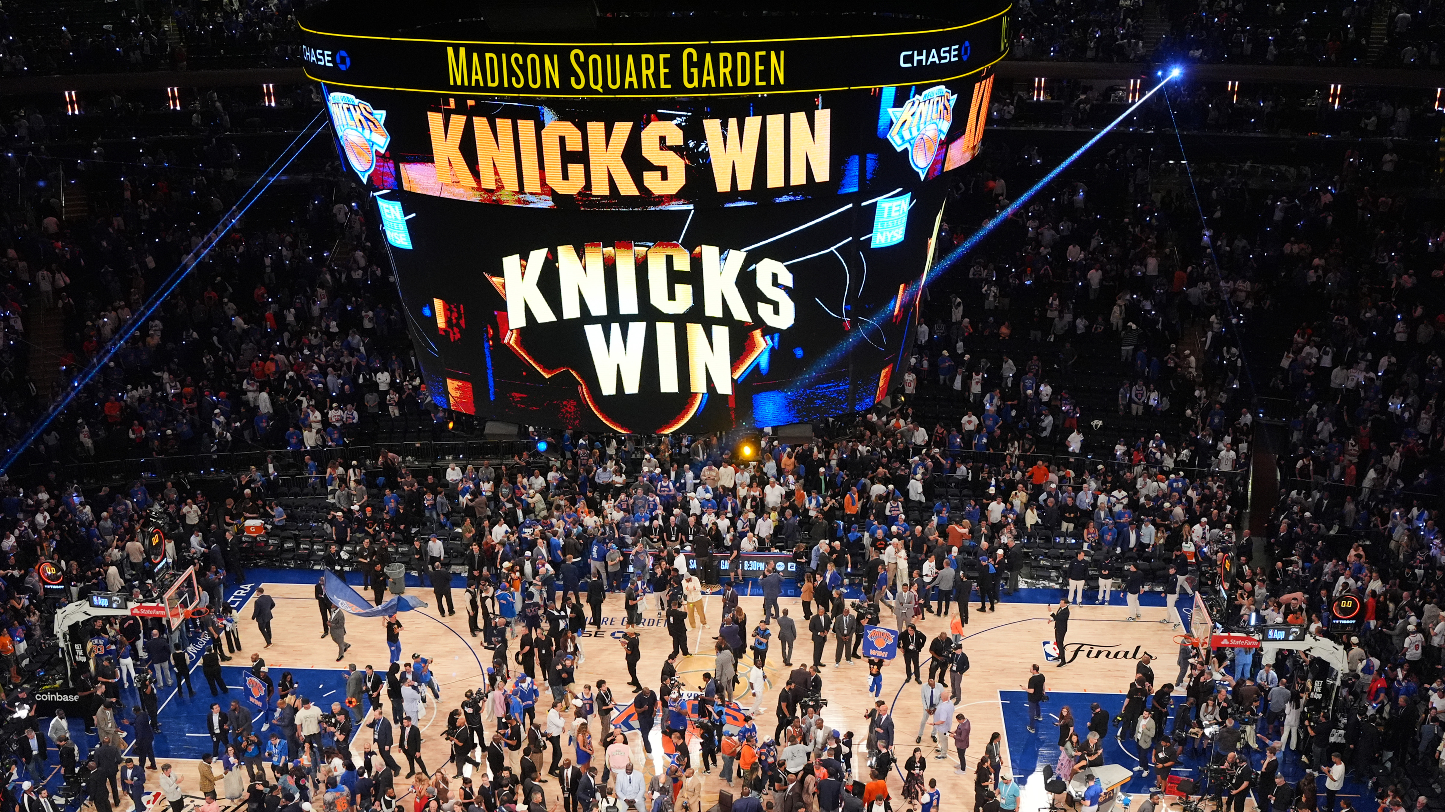 Players and fans celebrate after the New York Knicks' victory over the San Antonio Spurs in Game 4 of the NBA Finals basketball series, Wednesday, June 10, 2026, in New York.