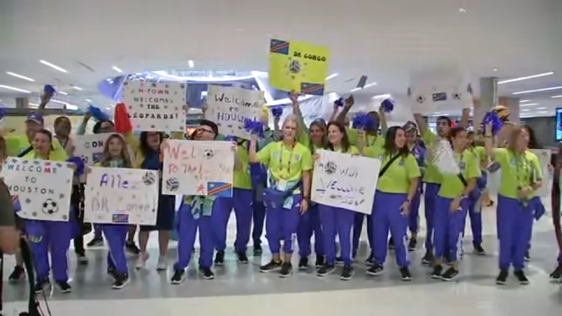 Congo fans welcomed the team with signs as it arrived at Houston's Bush Intercontinental Airport.