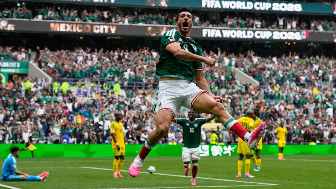 Mexico's Raul Jimenez celebrates after scoring his side's second goal during the World Cup Group A soccer match between Mexico and South Africa in Mexico City, June 11, 2026.