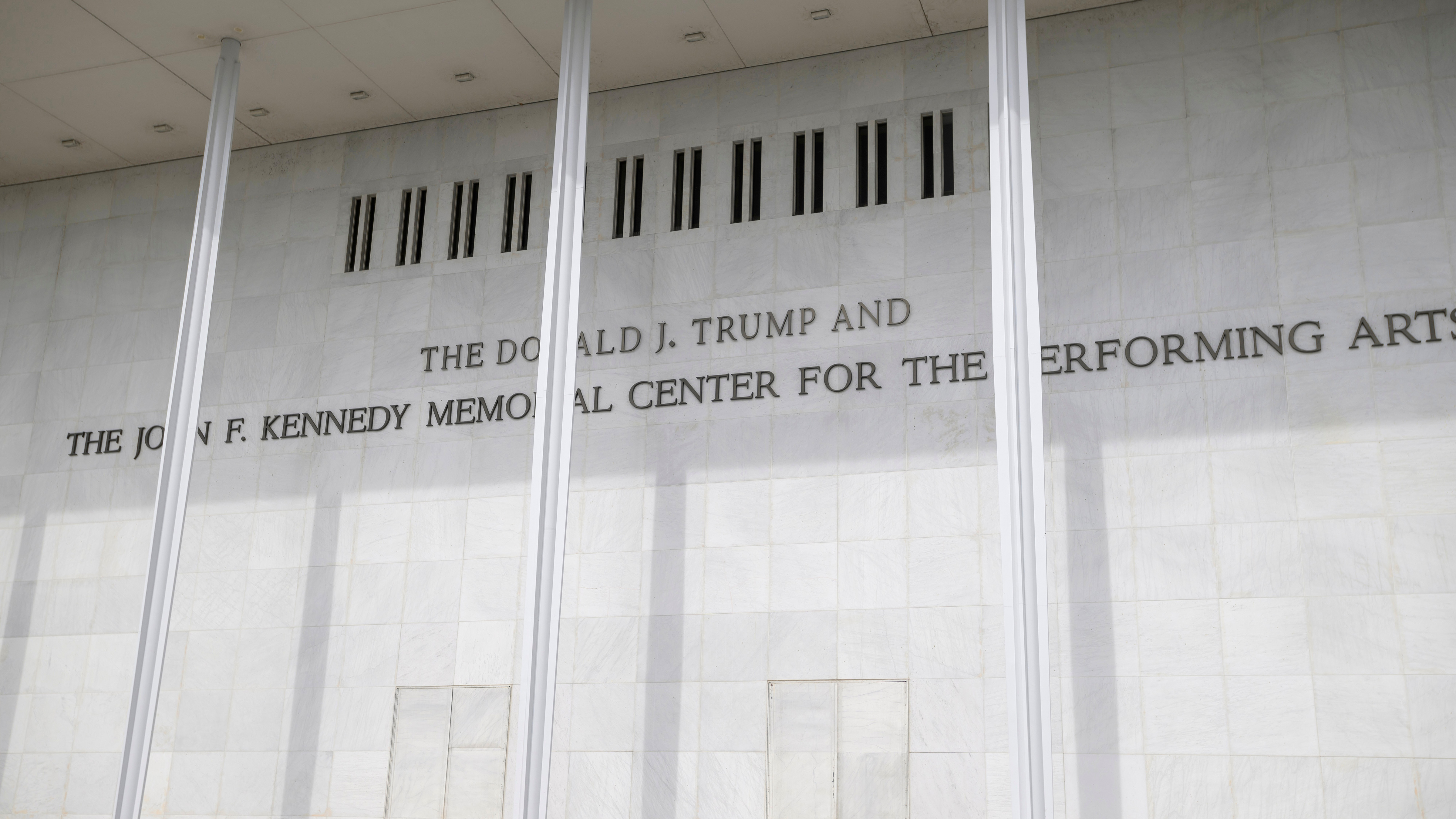 A man wheels a garbage bin outside of The John. F. Kennedy Center for the Performing Arts, Saturday, June 6, 2026, in Washington.