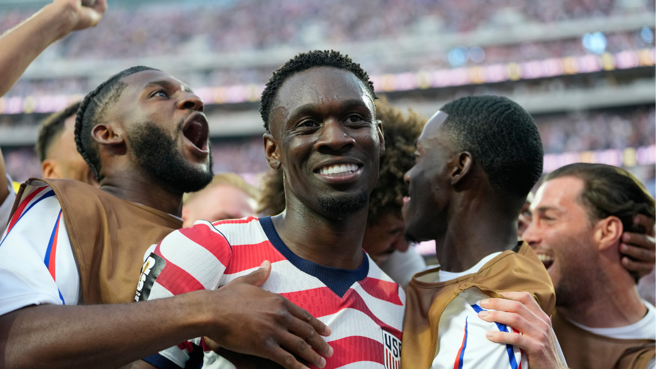 United States' Folarin Balogun (20) celebrates scoring his side's third goal against Paraguay with teammate Chris Richards during the World Cup Group D soccer match.