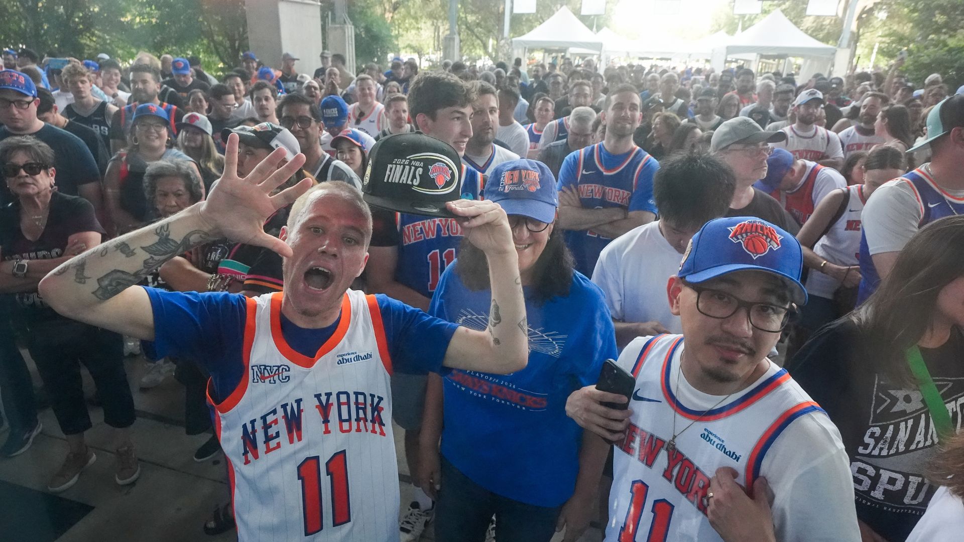 New York Knicks fans arrive prior to Game 5 of the NBA Finals basketball series against the San Antonio Spurs, Saturday, June 13, 2026, in San Antonio. (AP Photo/Ross D. Franklin)