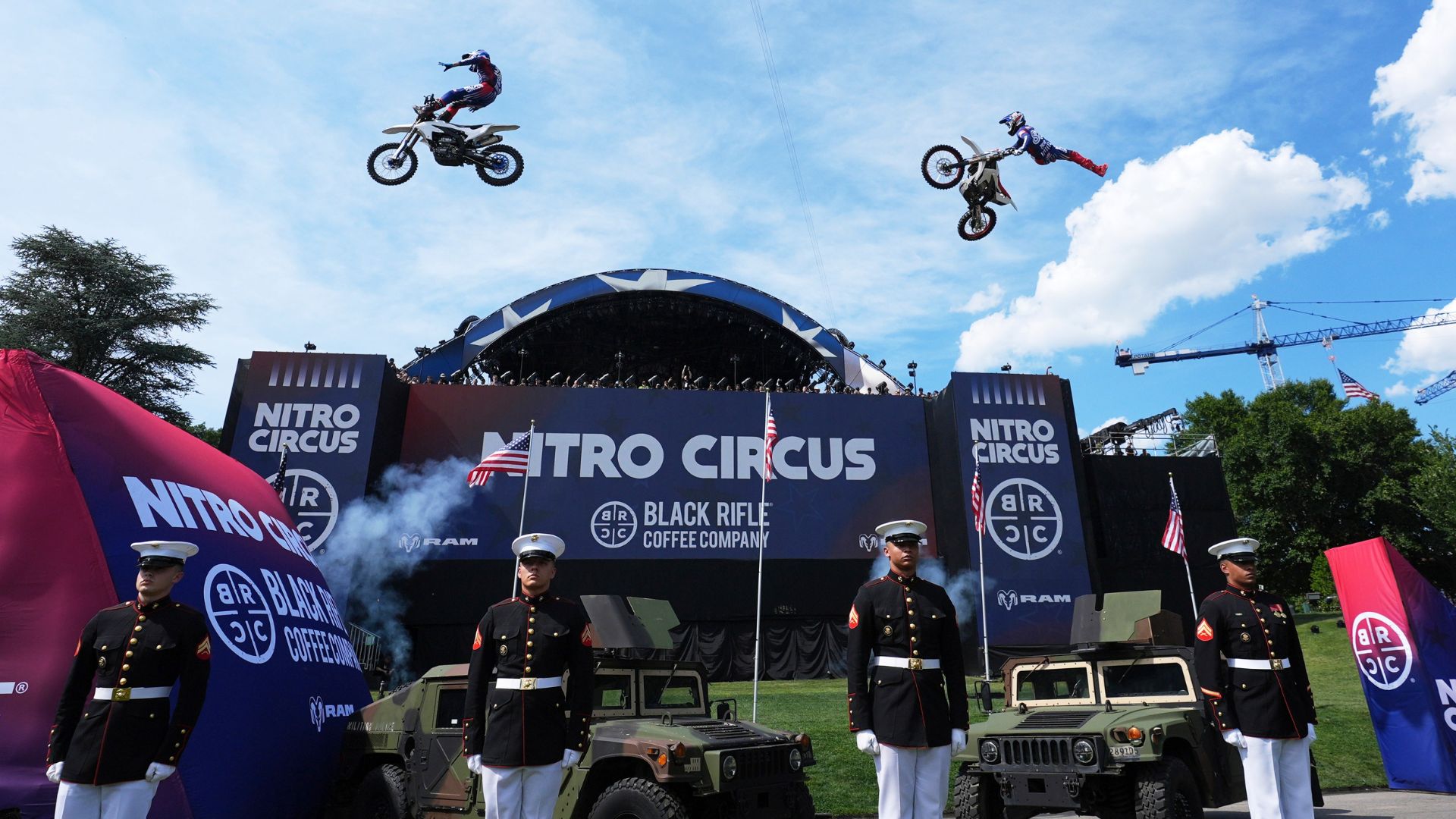 Motorsports athletes and stunt performers do a motorcycle jump ahead of the UFC Freedom 250 fights on the South Lawn of the White House, Saturday, June 13, 2026, in Washington.