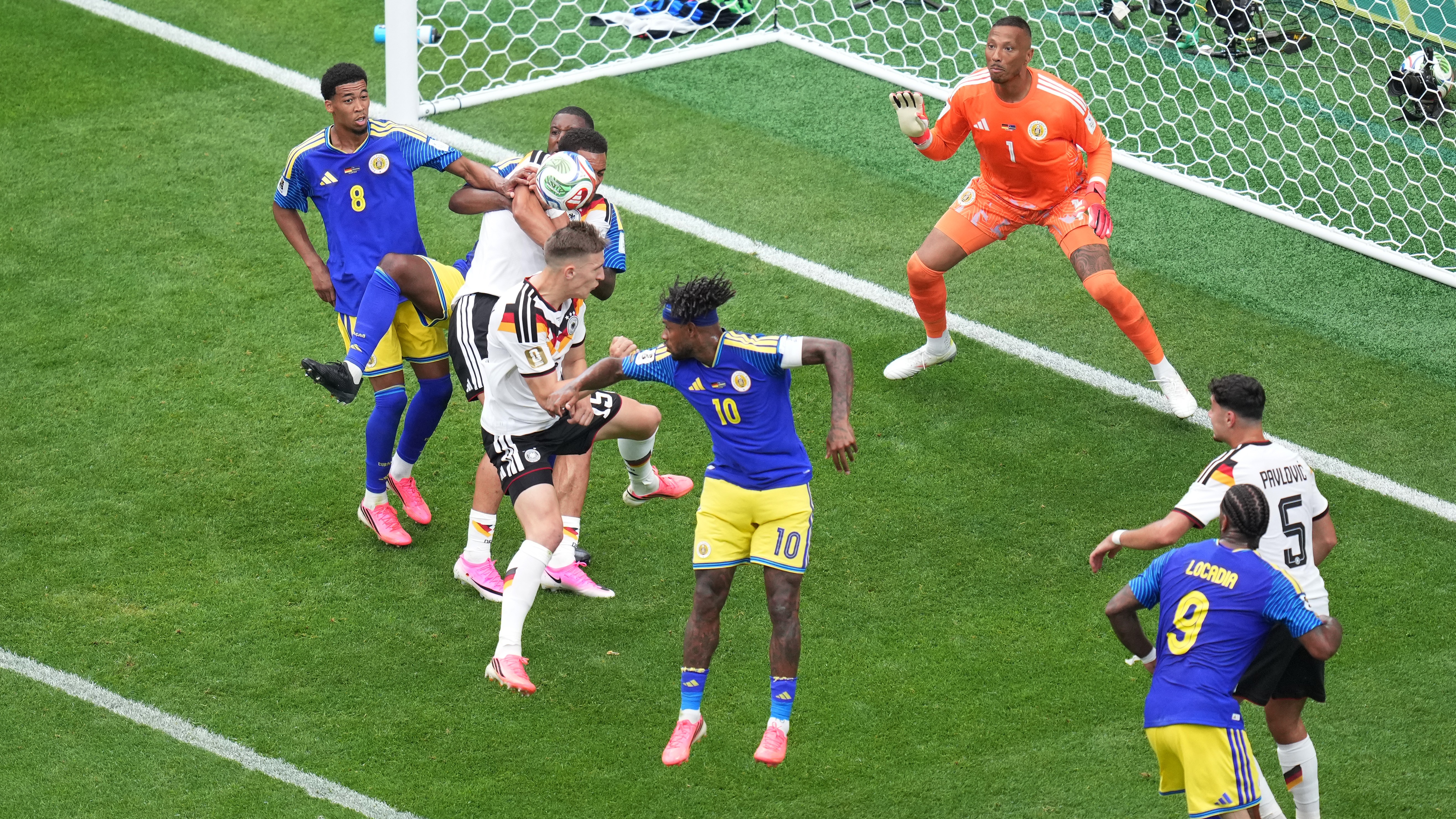 Germany's Schlotterbeck (15) scores a goal against Curacao's Room (1) during the World Cup Group E soccer match between Germany and Curacao in Houston, Sunday, June 14, 2026.
