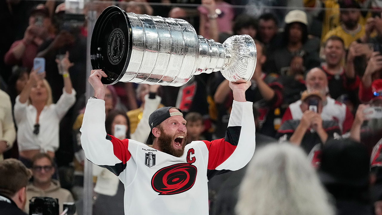 Conn Smythe winner and Canes captain Jordan Staal hoists the Stanley Cup.