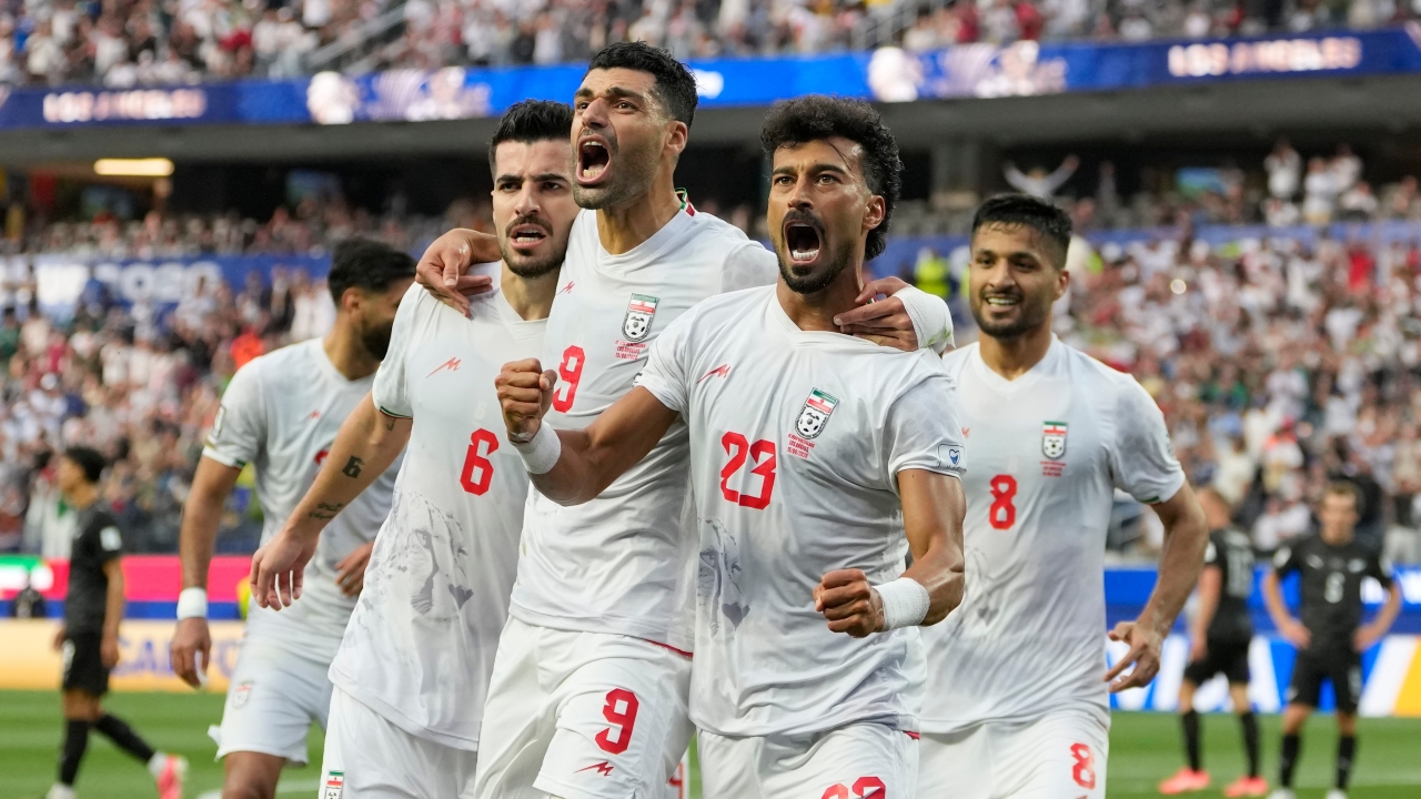 Iran's Ramin Rezaeian (23) celebrates with his teammates after scoring a goal during the World Cup Group G match between Iran and New Zealand in Inglewood, Calif., June 15, 2026.