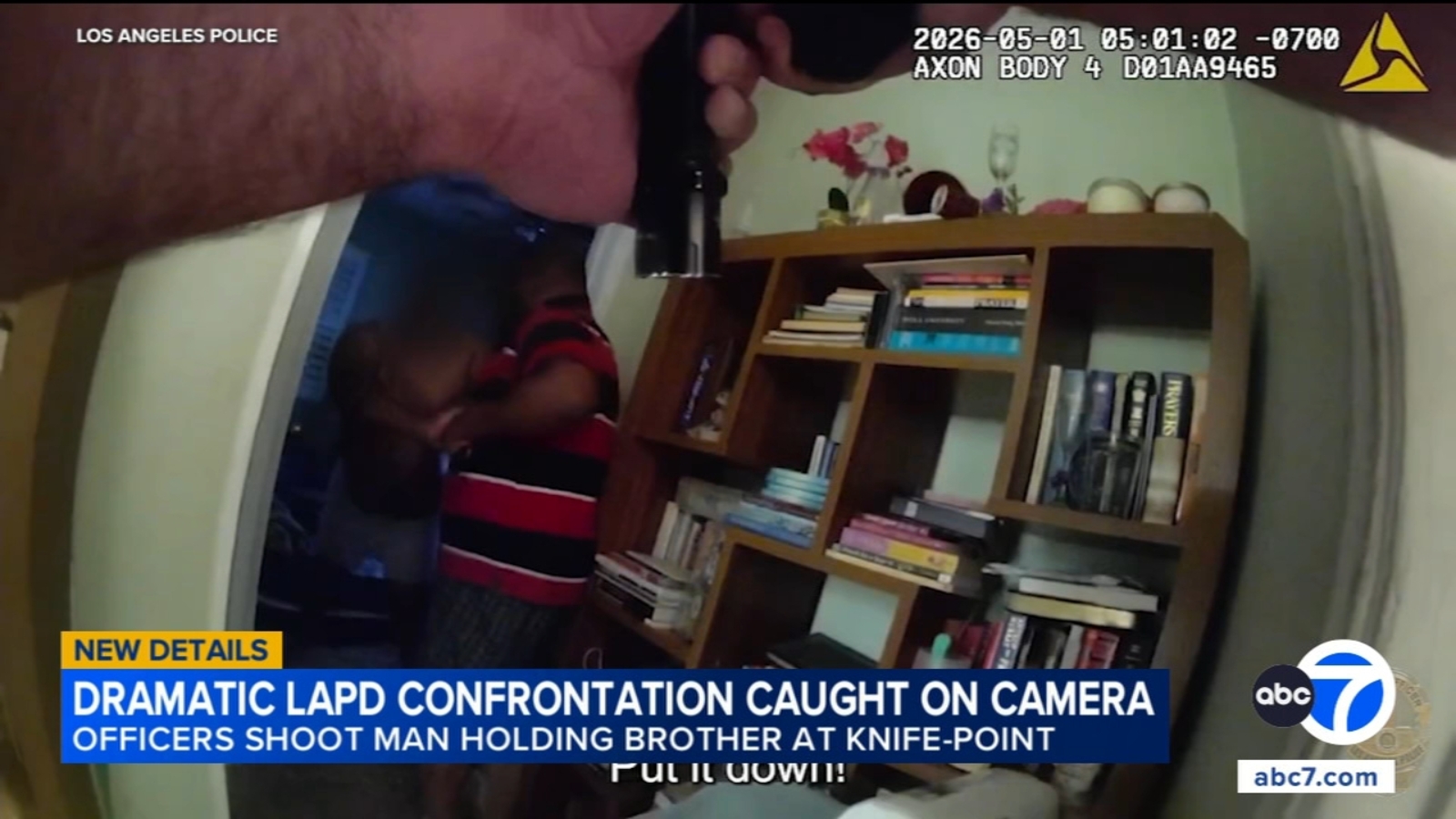 LAPD officer shoots man holding brother at knifepoint, bodycam video shows LAPD officer shoots man holding brother at knifepoint, bodycam video shows