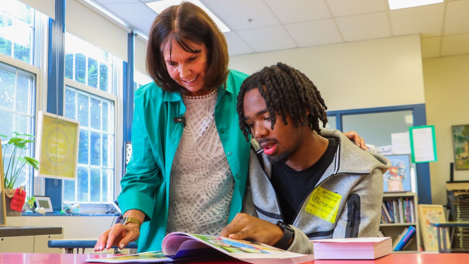 Retired teacher reconnects with former 1st grade students at time of ...