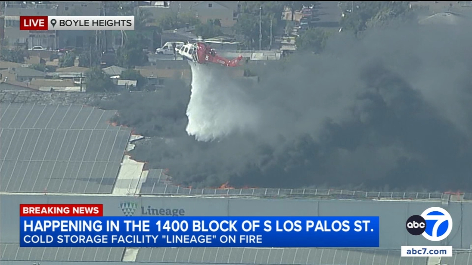 Water-dropping helicopters help halt flames at burning building with ...
