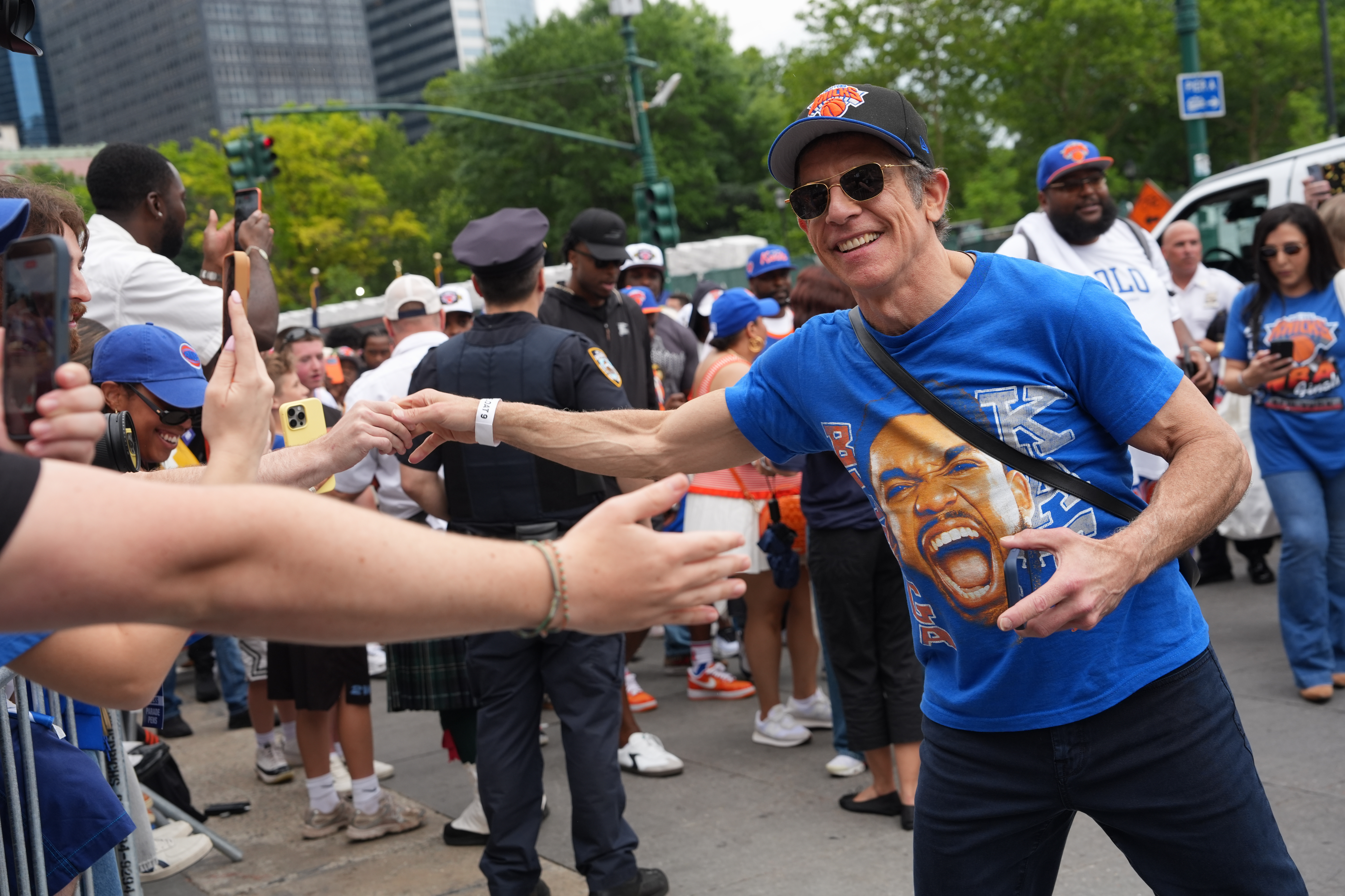 Ben Stiller shakes hands with fans during the New York Knicks' NBA championship parade Thursday, June 18, 2026, in New York.