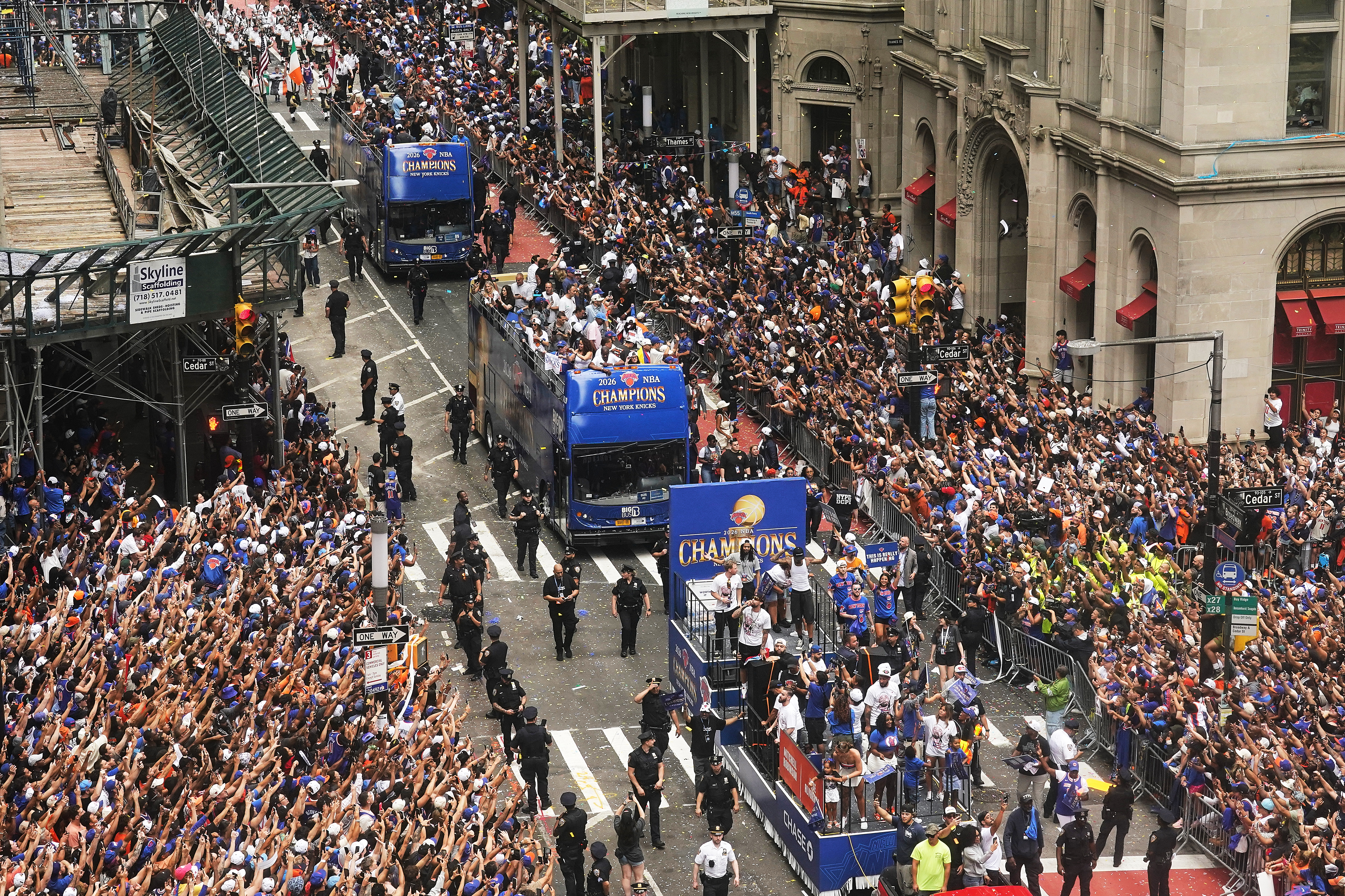 Crowds fill the sidewalks during the NBA Champion New York Knicks ticker-tape parade on Broadway, in New York's "Canyon of Heroes," Thursday, June 18, 2026.
