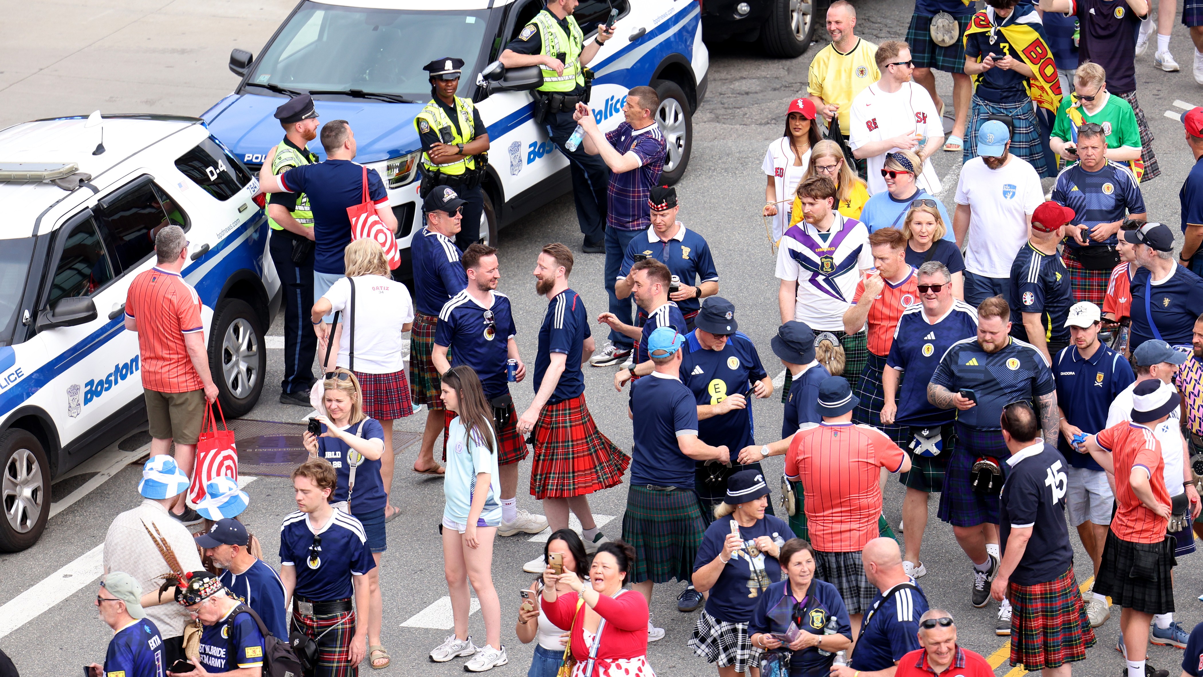 Scotland soccer fans take part in the Tartan Army March, making their way to Fenway Park ahead of a baseball game, Sunday, June 14, 2026, in Boston.