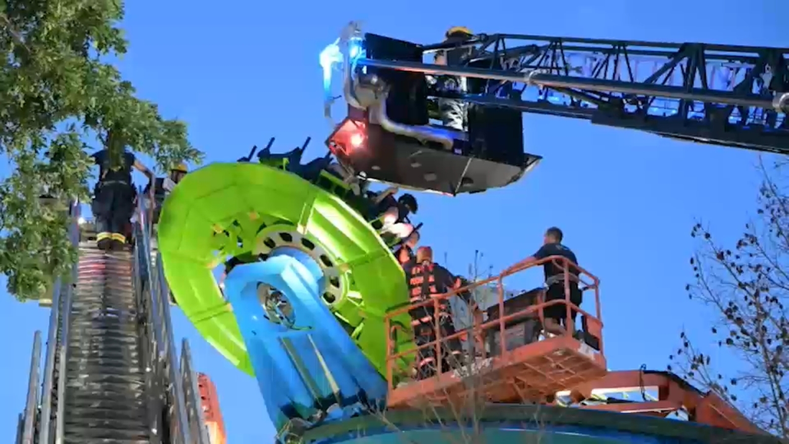 Firefighters rescue children stuck in the air on 'Wave Twister' ride at Adventureland in Farmingdale