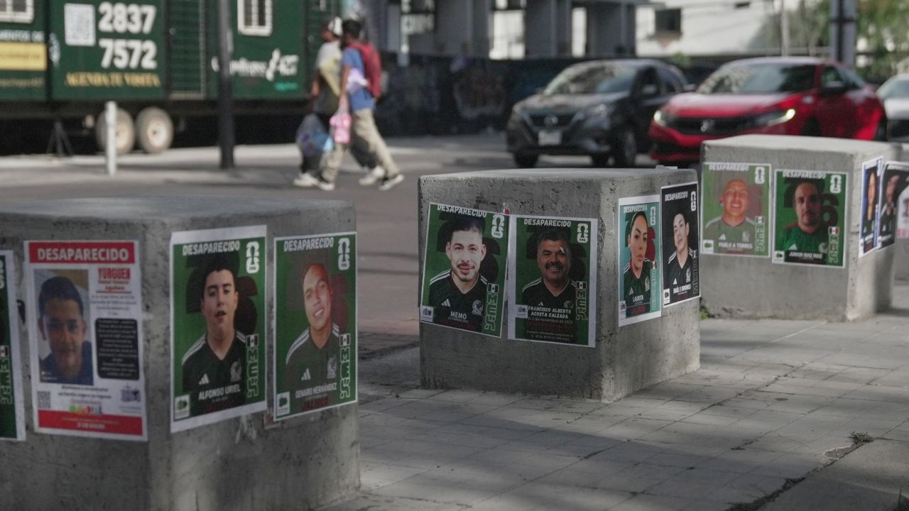 Posters of missing people wearing Mexican national soccer team jerseys to resemble World Cup sticker album cards are posted on a street in Guadalajara, Mexico, June 16, 2026.