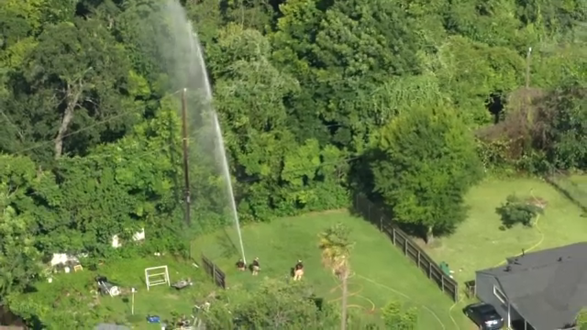 SkyEye13 captured images of crews dousing the trees and surrounding areas amid the ongoing tire fire in southeast Houston on Monday.