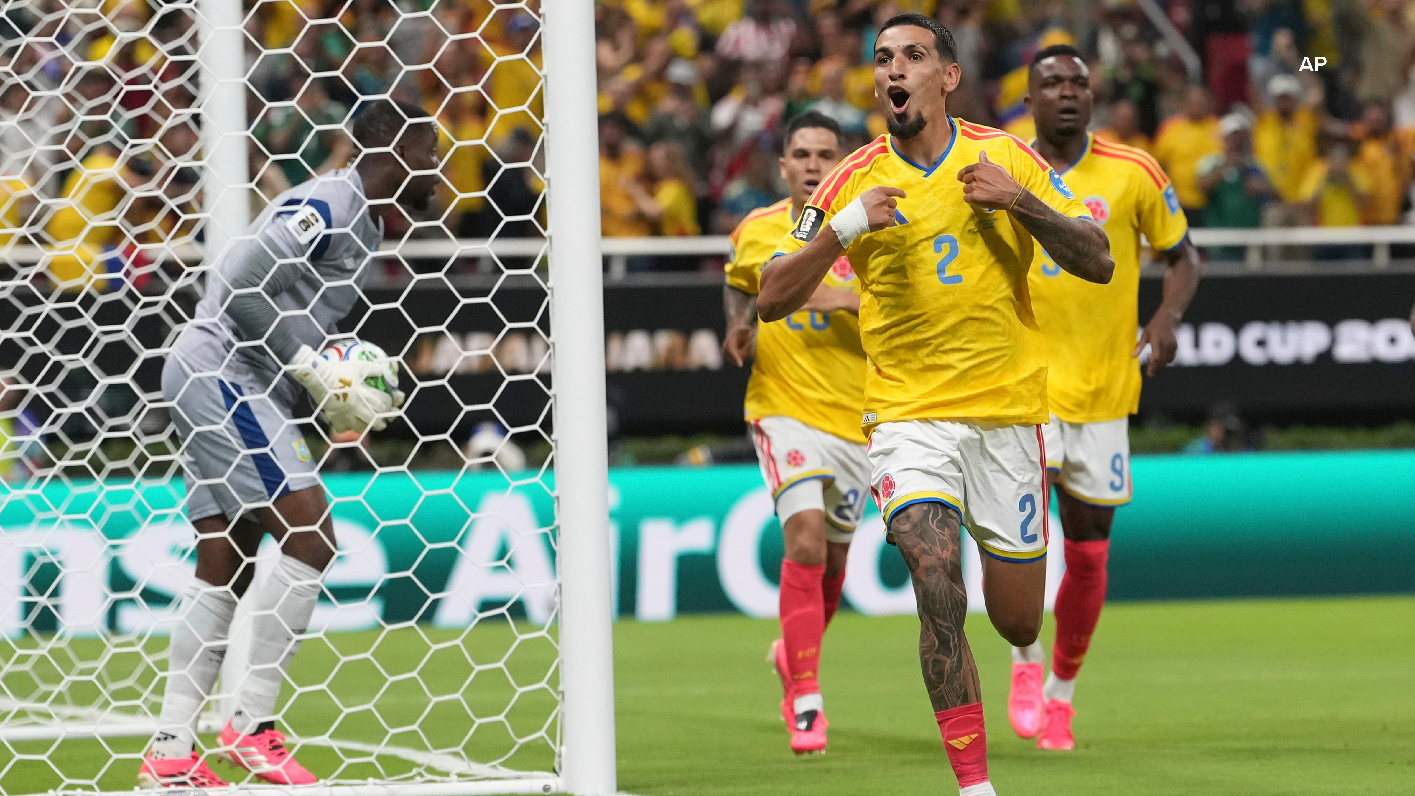 Colombia's Daniel Munoz (2) celebrates after scoring his side's opening goal during the World Cup Group K soccer match between Colombia and Congo. (AP Photo/Fernando Llano)