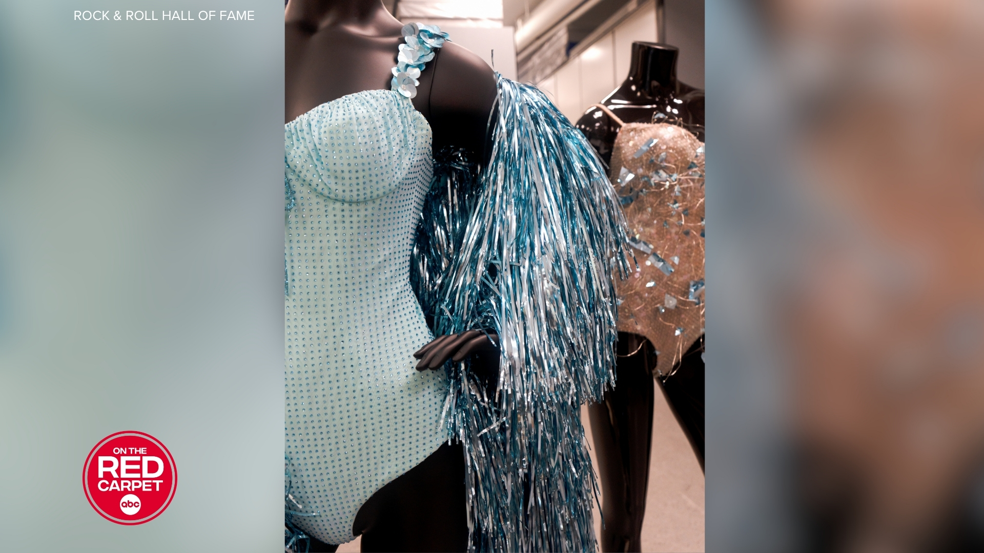 A different angle of Taylor Swift's blue ensemble from "The Fate of Ophelia" music video on display at the Rock & Roll Hall of Fame.
