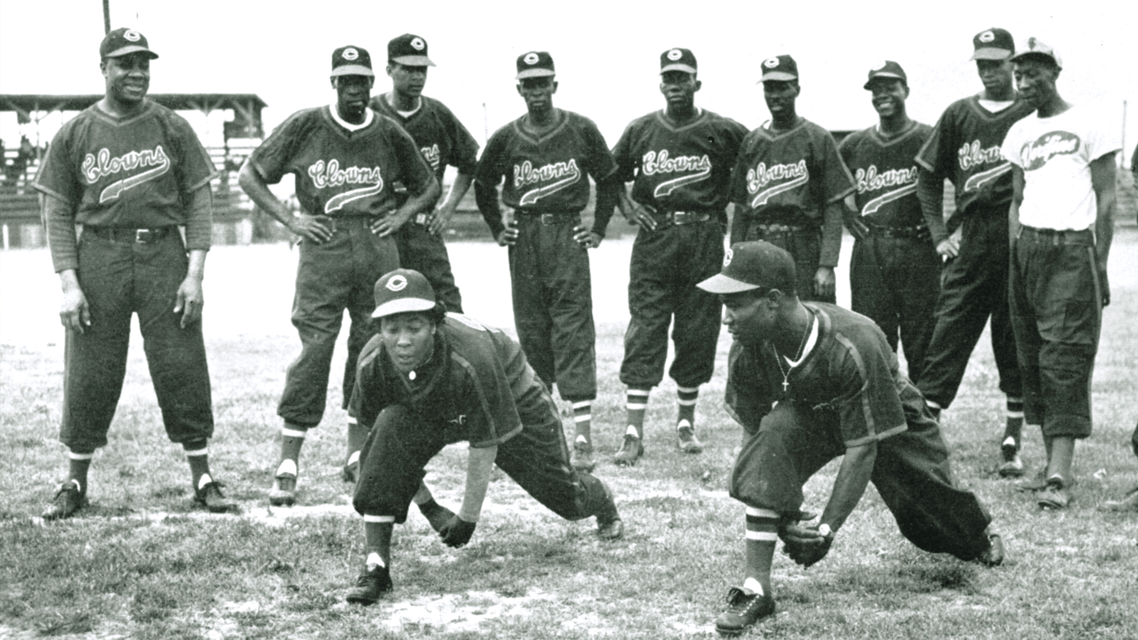 Teammates on the Indianapolis Clowns of the National Negro Leagues work out in a photograph around 1950 in Indianapolis, Indiana. 