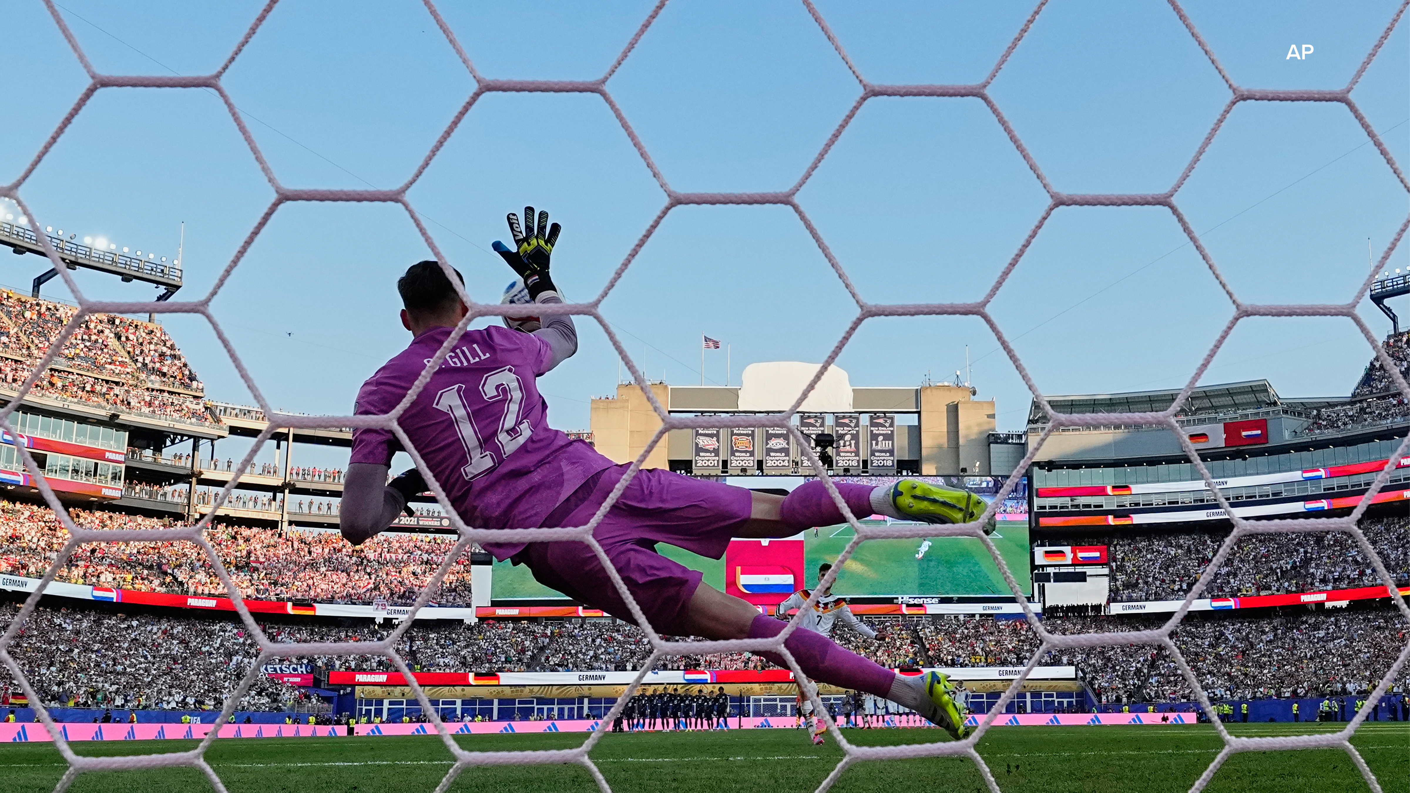 Paraguay goalkeeper Orlando Gill (12) makes a save during a penalty shootout during the World Cup round of 32 soccer match between Germany and Paraguay. (AP Photo/Martin Meissner)