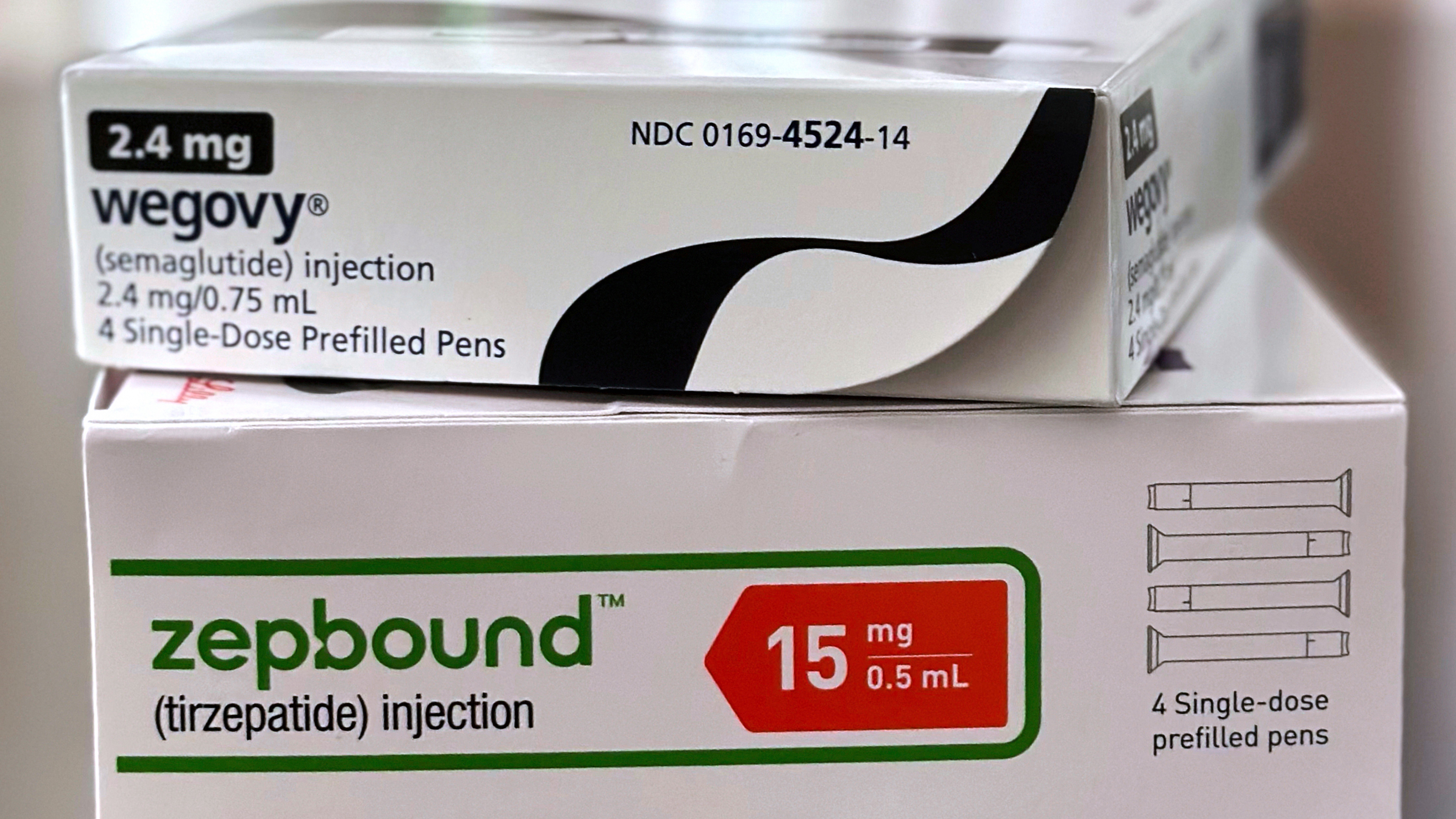 Boxes for the medications Wegovy and Zepbound are arranged for a photograph in California, May 8, 2025.