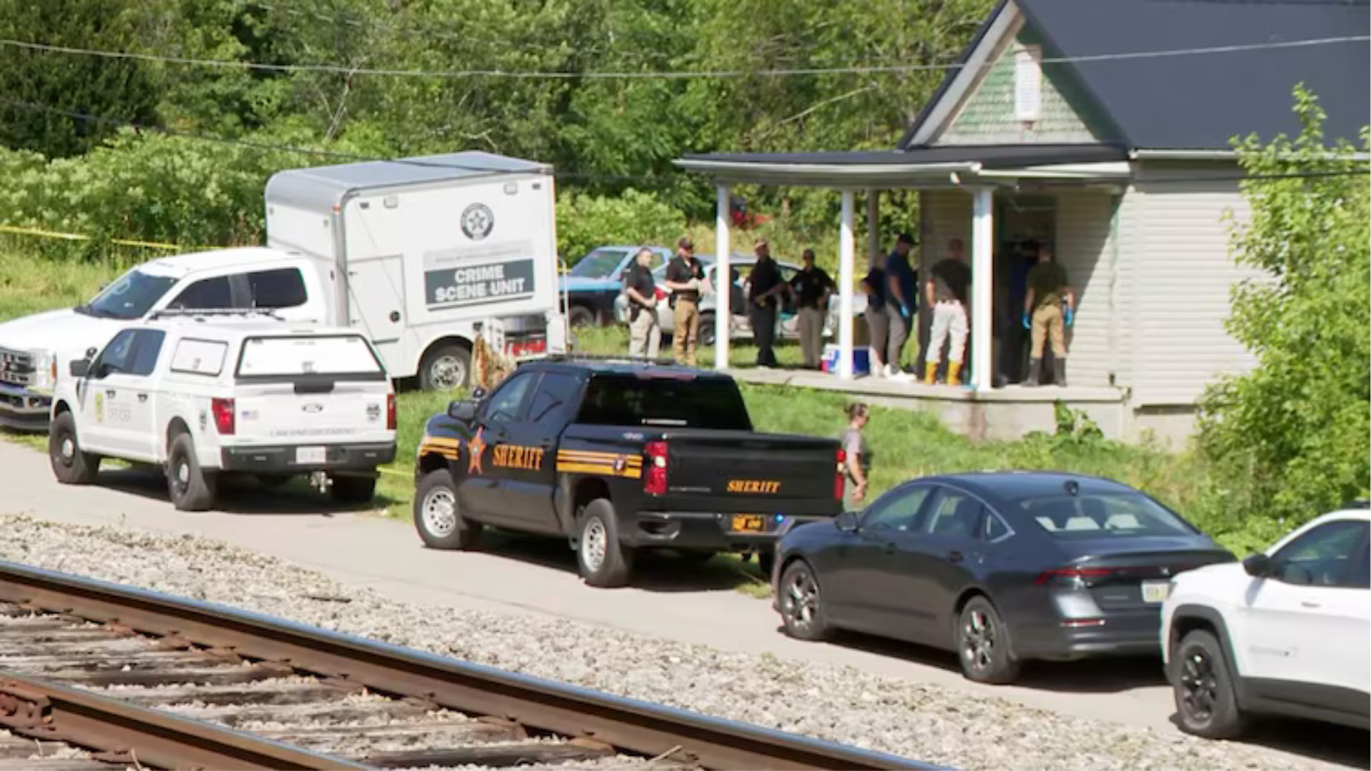Authorities are seen at a residence in Vinton County, Ohio, from which officials say 16 children were removed, June 30, 2026.